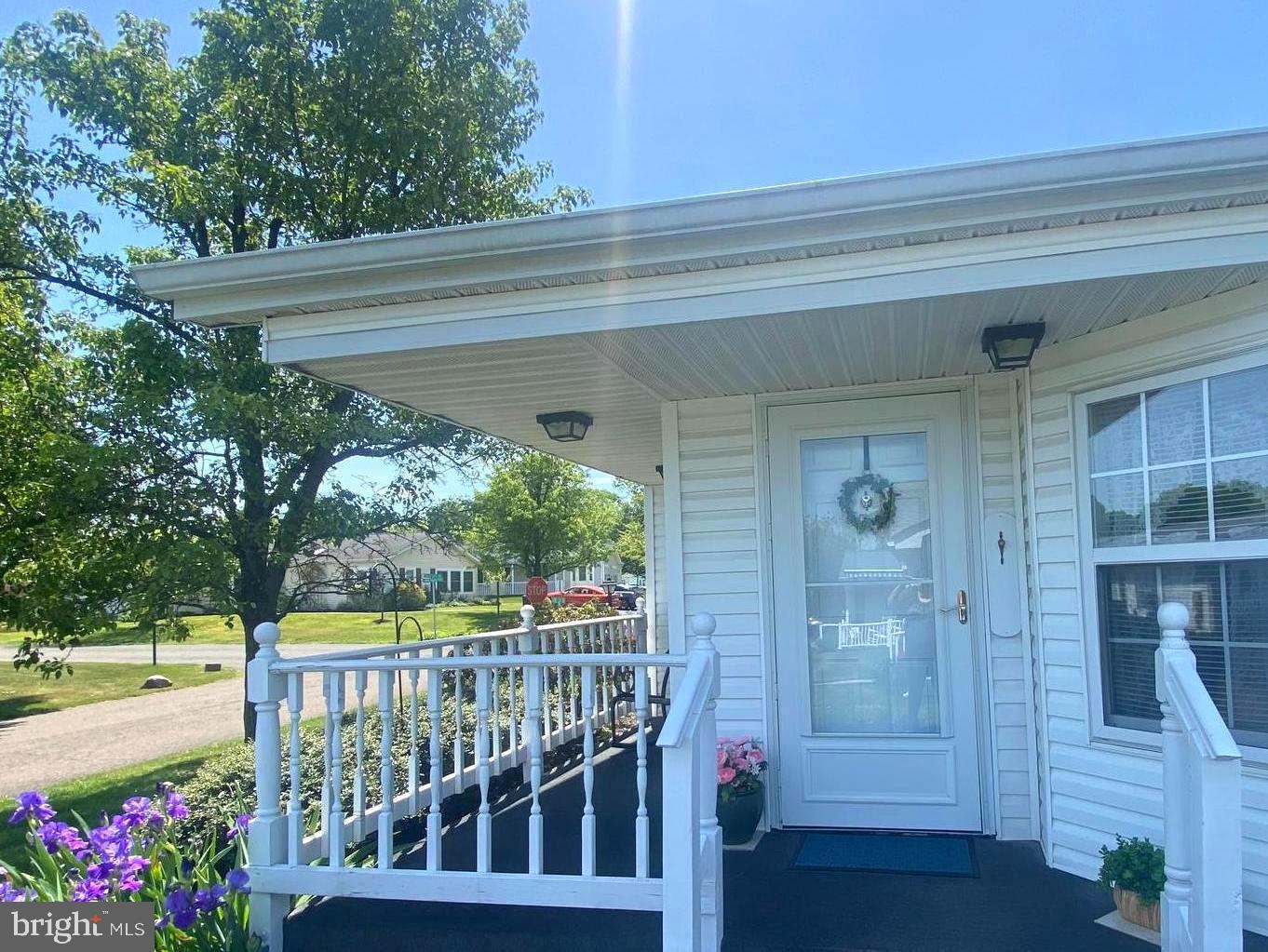 If you're looking for affordable, low-maintenance living in a fun 55+ community in central Bucks County - look no further! This super clean Chalfont model with a garage is priced to sell - making it one of the best values in the neighborhood! The welcoming Morning room with gleaming oak hardwood flooring and lots of windows lets the sunshine in! This is truly a flex space that can be a sitting area to enjoy coffee with friends, a home office, or whatever your imagination desires! The open floor plan with vaulted ceiling flows seamlessly from one room to the next. The Living room and Dining area offer plenty of space to entertain for the holidays. Dining area has updated flooring. The Kitchen has plenty of cabinet space, plus 2 wonderful skylights. The spacious primary Bedroom suite has a HUGE walk-in closet plus a linen closet. The attached Bathroom offers a soaking tub and stall shower, plus updated sinks, toilet, and flooring. The second Bedroom has new carpet and 2 closets. The updated hall Bath has a tile walk-in shower, updated sink, toilet and flooring. The Laundry room has loads of cabinet space, plus a new (2025) dryer. The in-demand garage provides ample space to park a car, plus storage cabinets. Smoke/Pet-Free home. Roof replaced in 2012 has 30 yr shingles.  Buckingham Springs offers so many amenities, from the refreshing pool and hot tub, to the gym, and fun social events - what’s not to love?! This house is ready for you to personalize to your liking.  Come see for yourself and be poolside by summer!