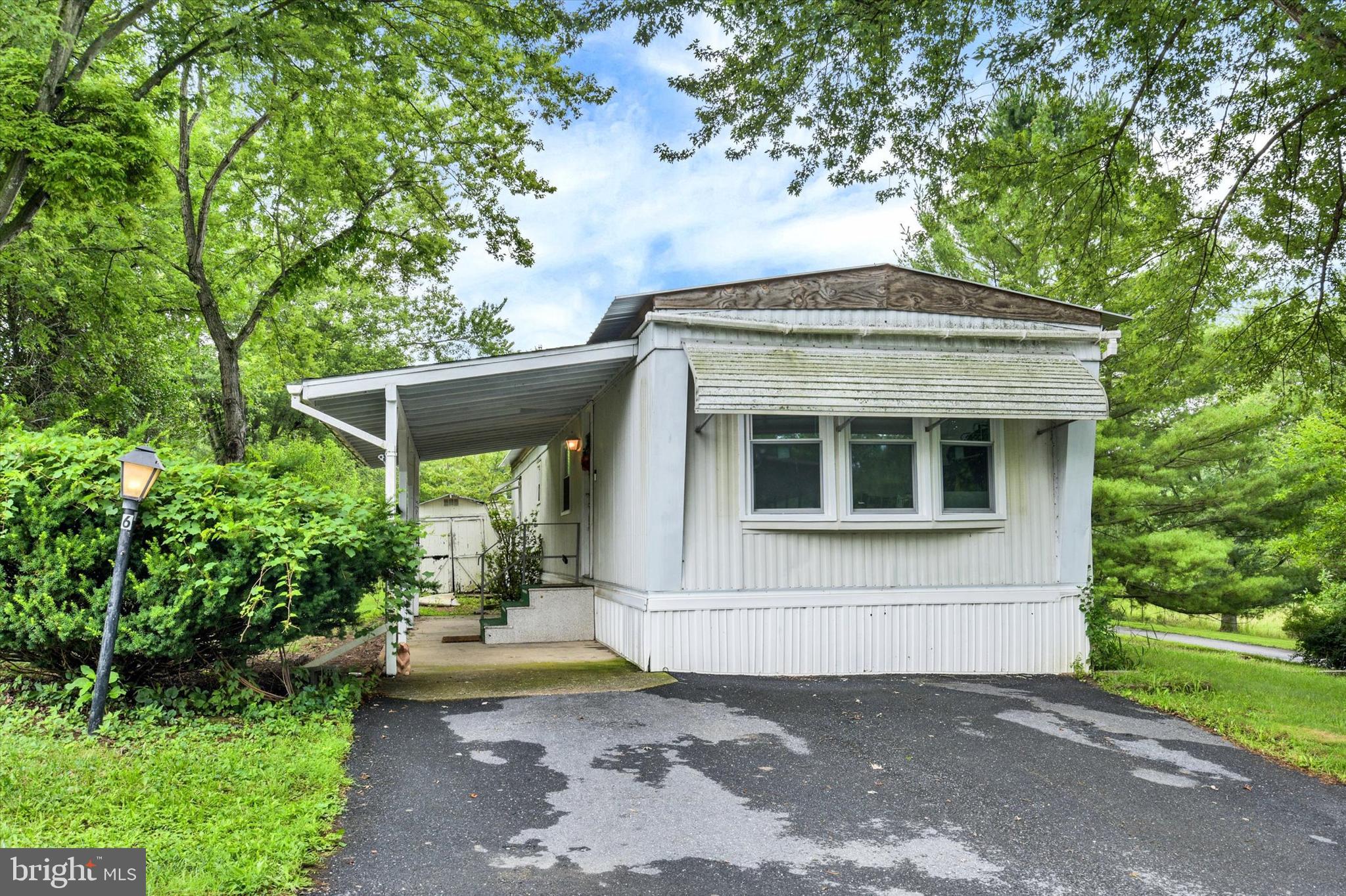Country Manor West community in Cumberland Valley Schools presents this updated manufactured ranch home. One floor living with a covered deck, which overlooks lush trees and a stream on a corner lot. Open floor plan. Natural gas, new roof, windows and LVP flooring throughout. Value priced and waiting for the next owner.