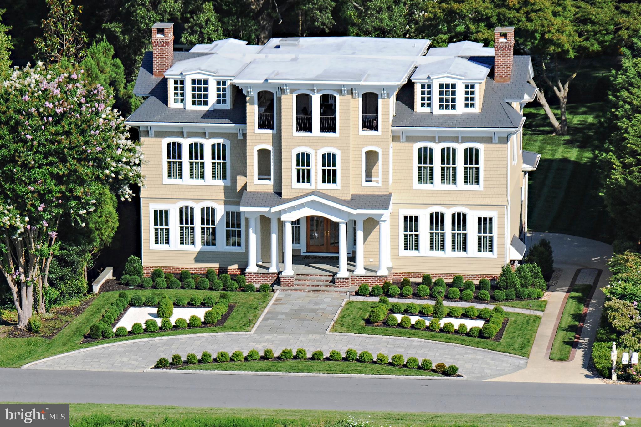 Spectacular views of Chesapeake Bay from this dramatic setting in Bay Ridge.  Elegant residence for the discerning buyer -- architectural millwork and moldings, custom hardwood floors, sweeping staircases and curated fixtures create a feeling of warmth and well-being.  Enjoy the views from large windows that provide wonderful light and an airy feeling throughout the home.  Large rooms with marvelous flow and cook's kitchen for entertaining in style.  There is an elevator to all 4 levels including the top floor with covered loggia looking out to the Bay, luxurious master suite on the second floor; lower level with in-law/nanny suite, storage and 3-car garage.  A perfect place to call home!