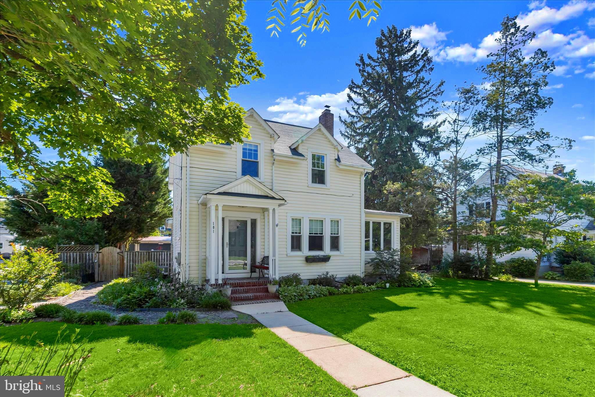 Welcome to 101 Locust Drive, a meticulously maintained colonial brimming with charm and character, ideally situated on a picture-perfect street in the heart of Catonsville offering an incredible in-ground heated saltwater pool! This inviting home features an open-concept main level with gleaming hardwood floors and sun-filled interiors throughout. The living room is anchored by a cozy fireplace, creating the perfect gathering space, while the dining room offers seamless access to a screened porch overlooking the backyard retreat. The eat-in kitchen is thoughtfully designed with ample cabinetry, granite countertops, a center island with breakfast bar seating, and stylish pendant lighting. A bright sunroom expands the living space and offers flexibility as a potential third bedroom. Completing the main level are a full bath, laundry area, and direct access to the outdoor oasis.  Upstairs, you'll find two comfortable bedrooms, a full bath, and two versatile bonus rooms, including one with access to a floored attic providing abundant storage space. The unfinished lower level offers additional storage and includes a convenient "Pittsburgh" toilet. Outside, the beautifully landscaped grounds filled with perennial gardens create a private retreat highlighted by a heated in-ground saltwater pool, spacious patio, covered seating area, deck, detached garage, privacy-fenced backyard, and welcoming covered front porch. Combining timeless charm with exceptional outdoor living, this special Catonsville home is ready to be enjoyed in every season.  Updates in the last 7 years include gas boiler, central air, roof and windows.  Enjoy nearby shops and restaurants, Farmers' Markets, 4th of July festivities, free music venues, parks and trails.