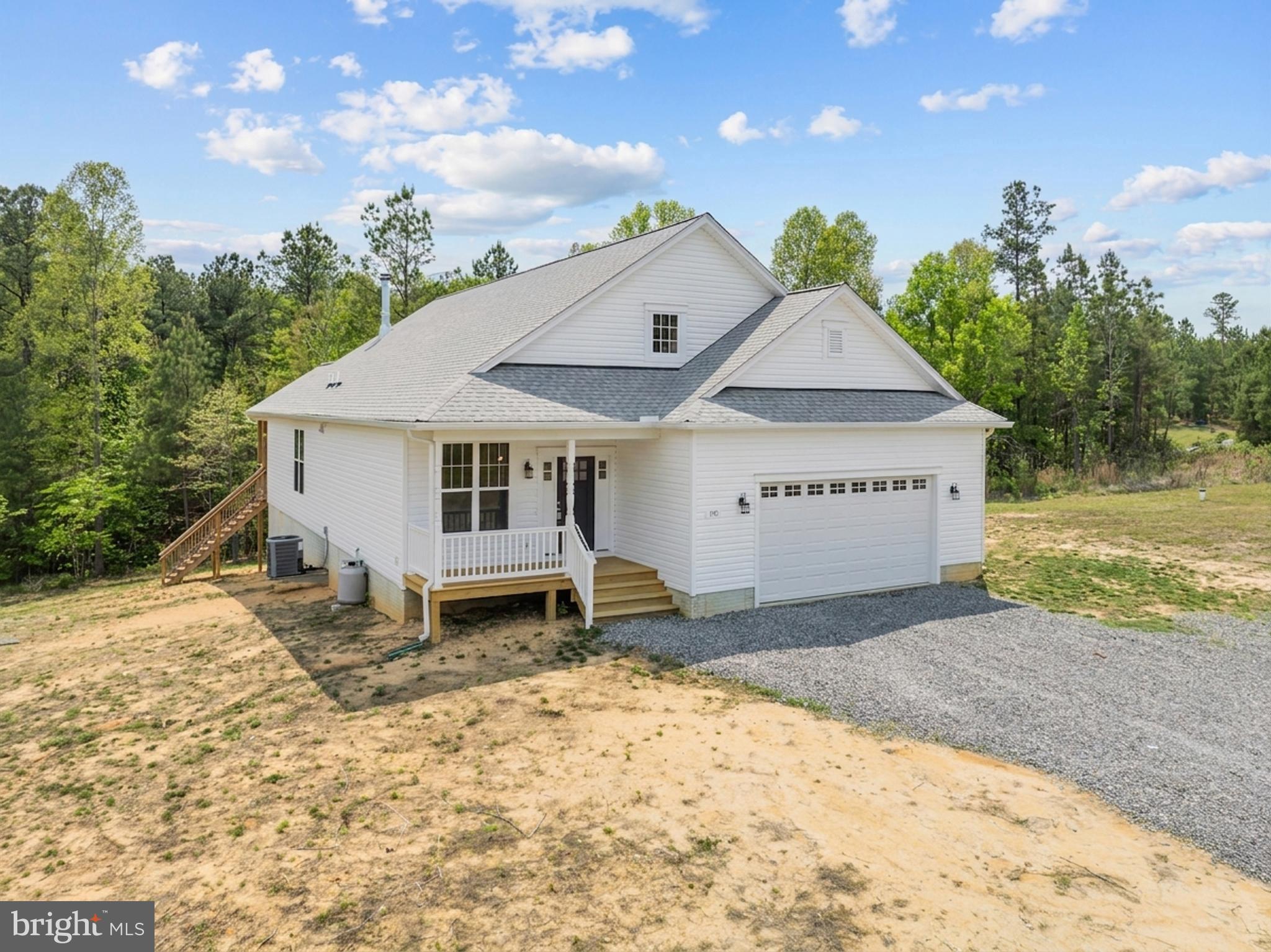 Originally built by Bethel Builders, like-new construction offering the ease of one-level living with the added flexibility of a spacious bonus room or 4th bedroom on the second level. Situated on expansive acreage, this property delivers exceptional privacy and a peaceful, retreat-like setting. Enjoy the peace and quiet of the country while being roughly 30 minutes to the shopping in Short Pump! Or, take a quick drive for a lake day at Lake Anna! Under an hour commute into downtown Richmond or Charlottesville let's you live in privacy and work locally. 

The main level features an open-concept design seamlessly connecting the living, dining, and kitchen areas—ideal for everyday living and entertaining. The living room is anchored by a cozy corner gas fireplace with stone surround, creating a warm focal point. A separate formal living space provides additional flexibility for a home office, sitting room, or playroom. The chef’s kitchen is well-appointed with granite countertops, a large center island, stainless steel appliances, gas cooking with range hood, and a double wall oven (3 ovens total!) - perfect for gatherings and meal prep. An oversized pantry adds abundant storage. The primary suite offers a relaxing retreat, complete with a spa-like 5-piece en-suite featuring a freestanding soaking tub, double vanity, large tiled Roman shower with dual rain showerheads, and a linen closet. Enjoy outdoor living on the covered back porch overlooking your private acreage. Additional highlights include a two-car attached garage and a walkout basement filled with natural light, offering excellent potential for future finished space. With four total bedrooms, flexible living areas, and major systems - including roof, HVAC, and windows - all less than two years old, this home offers peace of mind along with modern comfort.