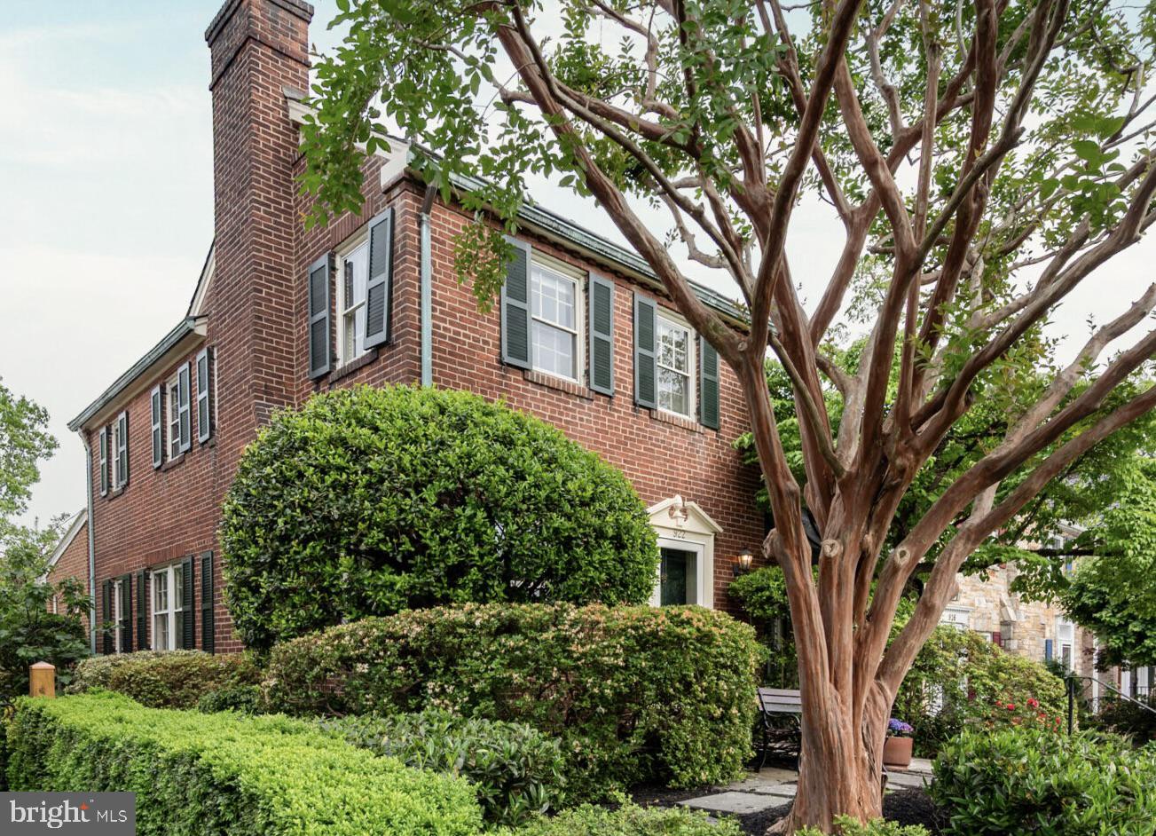 This bright, end unit row home on a dead-end block in Yates Gardens - with TWO living spaces on the main level (LR and Family Room Addition) - is move-in ready, and with some relatively modest updates, could go from charming to fabulous. The hard work and big investment – that family room addition – is already done. The kitchen - with TWO views to the outdoors - is nice and completely functional, with white cabinets and Corian counters. It’s also the kind of space that a buyer could redesign to stunning effect without taking it down to the studs. Same story with the upper-level bath: It’s retro-charming as-is, and a relatively modest update away from something personalized and special. Buyers should also know that others in this model have added an en-suite bath on the upper level, so that path exists if someone wants it. *** Check out the VIDEO TOUR!! *** Enter the main level to a spacious and charming living room with a wood-burning fireplace. A broad opening leads to the dining room and on to a kitchen with white cabinets, Corian counters, and coordinated appliances (refrig 2024, dishwasher 2020). A pass-through connects to a striking family room addition, where light streams through a bay window and two skylights above, a second fireplace (gas) provides warmth and atmosphere, and the built-ins offer both open and closed shelving. A powder room is tucked in the corner for convenience. *** The upper level features three generous bedrooms and a retro-styled full bath. The original 1940s hardwood floors run throughout the main and upper levels, with tile in the kitchen and family room. *** There is a spacious rec room on the lower level, recently painted and updated with vinyl plank flooring. A laundry room, second full bath, utility room, and two triple storage closets (!) finish out the level. *** The generous lot is a nature lover's dream in the city. In front, seasonal tulips, azaleas, crepe myrtle, and multi-colored azaleas put on a show throughout the year. The path to the backyard is flanked by more perennials, irises, boxwoods, tulips, daffodils, roses and even a young magnolia and a prolific fig tree. In the backyard, you'll find a wisteria-covered pergola with a hanging swing and a shed for all your outdoor gear. Holly, oak leaf hydrangea, dogwood and lilacs provide a natural privacy screen on 3 sides and a beloved habitat for cardinals, robins and more. A handy back gate opens to the public alley for easy trash and recycling access. As you walk back up the steps to the back door, you’ll catch the glorious scent of honeysuckle. *** Located at the far southern end of Old Town, the block has two service roads allowing private parking for residents, and is described by one resident as embodying the difference between living in a neighborhood and simply having a street address.