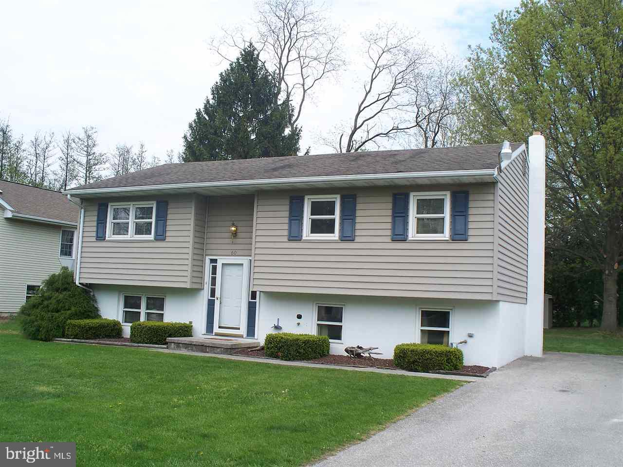 Beautiful hardwood floors in the foyer, living room, steps & hallway.  Master bedroom has private door to bath. Lower level features a family room, 4th bedroom, 1/2 bath and  L-shaped workshop/storage/laundry area w/ sink. Newer 3 zone gas furnace, central air, &  tankless hot water heater. 10X21 Covered Deck & private back yard w/ shed.  Pull down attic storage