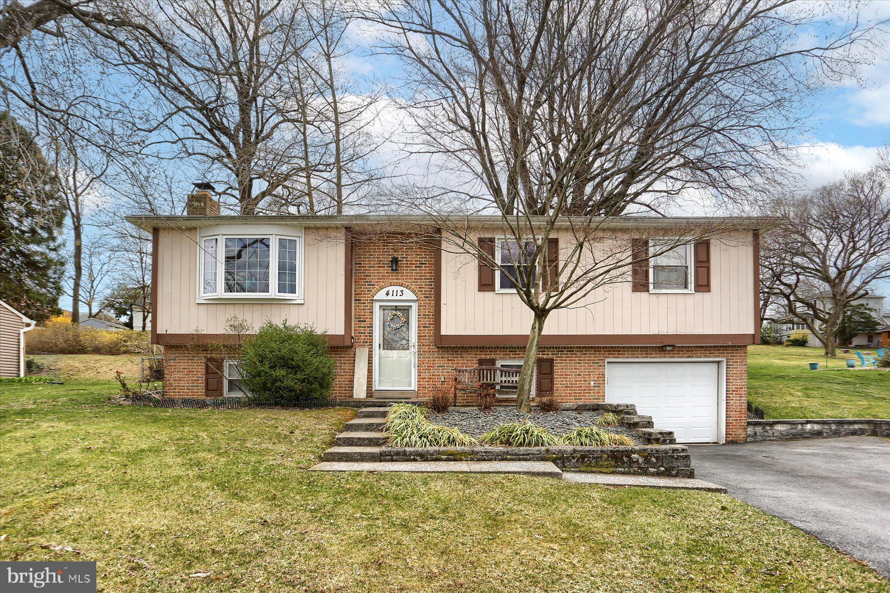 Welcome to this well-appointed bi-level home, offering both comfort and convenience in a wonderful neighborhood.  With four spacious bedrooms, two and a half baths, and a thoughtfully designed layout, this home is perfect for anyone seeking to enjoy an ideal blend of private living and easy access to everyday amenities.  As you step inside, you'll be greeted by an ample living room, and a bright and airy combination kitchen and dining room, ideal for hosting gatherings or enjoying family meals.  The kitchen flows seamlessly into a charming sunroom,  with a space to add your own  bar — the perfect spot to unwind or entertain guests. A large deck off the sunroom provides ample space for outdoor dining, relaxation, and enjoying warm evenings.  The lower level of the home is a true standout, offering an enormous recreation room featuring a cozy wood-burning fireplace. This versatile space is perfect for creating a family movie night setting, a game room, or a peaceful retreat.   Additionally, the one-car garage adds extra convenience and storage space.  Situated on a great lot with a fenced in backyard, this is the perfect place for pets  and guests to enjoy!  Located in Central Dauphin School District, and just minutes from shopping centers, restaurants, and other local amenities, this home offers the perfect balance of suburban tranquility and urban convenience.  Don’t miss out on the opportunity to own this beautiful home in an unbeatable location!