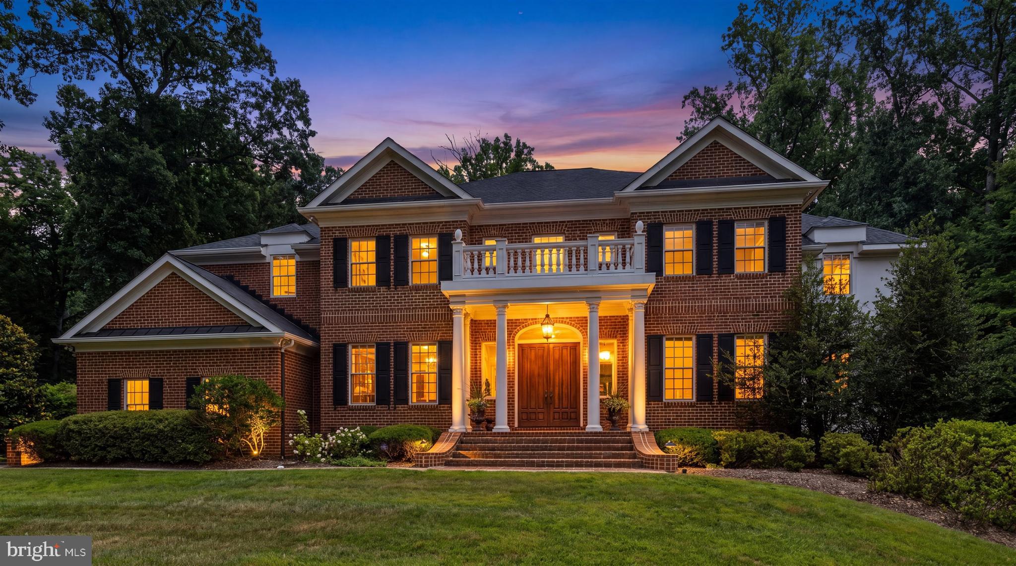 Some homes simply offer more space. Others offer a way of living that becomes part of your story. Hidden among the mature trees of Chestnut Woods, this extraordinary custom brick estate was designed for the moments that matter most—the holiday dinners that linger late into the evening, quiet mornings with coffee overlooking the woods, and celebrations that bring everyone together under one roof. From the moment the handcrafted mahogany doors swing open, the home reveals itself with quiet confidence rather than extravagance. A dramatic two-story foyer, marble flooring with granite inlay, artisan millwork, and a sweeping wrought-iron staircase introduce a residence where timeless craftsmanship takes precedence over passing trends. Natural light follows you from room to room, dancing across rich Santos mahogany floors, soaring ceilings, custom moldings, and oversized windows that frame the changing seasons outside. Every space feels intentional—grand enough for elegant entertaining yet comfortable enough to enjoy every single day. The heart of the home is a kitchen designed not simply for cooking, but for gathering. Everyone naturally gravitates to the expansive island while conversations flow effortlessly into the morning room, family room, and surrounding entertaining spaces. Outfitted with Viking Professional appliances, a Sub-Zero refrigerator, custom cabinetry, granite countertops, a generous walk-in pantry, warming drawer, Scotsman ice maker, and thoughtful prep spaces, it is equally capable of hosting Thanksgiving dinner or an intimate Sunday breakfast. Formal occasions unfold beautifully in the coffered dining room, while the adjoining living room, conservatory, and wet bar create an effortless sequence for entertaining. A richly appointed private study and additional office or creative workspace acknowledge the way we live today—where home has become both sanctuary and workplace. Upstairs, the primary suite feels less like a bedroom and more like a private retreat. Wake beside the glow of the fireplace, enjoy morning coffee in the sitting room, and unwind in a spa-inspired bath with soaking tub, oversized shower, dual vanities, and two custom walk-in closets designed for effortless organization. Three additional bedrooms, beautifully appointed baths, and an expansive bonus room provide remarkable flexibility for growth and change. The walkout lower level transforms the home’s possibilities even further. Whether imagined as a private guest residence, multigenerational living, an au pair suite, executive workspace, or simply the ultimate recreation level, it offers a sixth bedroom, full bath, media room, fitness area, wet bar, expansive gathering spaces, and exceptional storage—adapting as life changes without compromise. Outside, bluestone terraces, winding brick and stone walkways, manicured gardens, and a level lawn dissolve into a peaceful woodland backdrop where birdsong replaces traffic and every season brings its own quiet beauty. It is the kind of setting that invites long conversations around the table, evenings beneath the stars, and weekends spent without ever wanting to leave home. Behind the scenes, thoughtful investments provide confidence as well as beauty, including a new 50-year architectural roof installed in June 2026, three-zone HVAC, an oversized three-car garage, Verizon Fios availability, security system, and the meticulous care that only devoted ownership can provide. Just minutes from Hunt Valley Town Centre, acclaimed golf, exceptional dining, Worthington Valley’s scenic horse country, and some of Maryland’s most beautiful countryside, the location offers the perfect balance of convenience and tranquility. Luxury is often defined by finishes. Legacy is defined by the life lived within them. This is more than an exceptional residence. It is a home thoughtfully designed to become part of your next chapter.