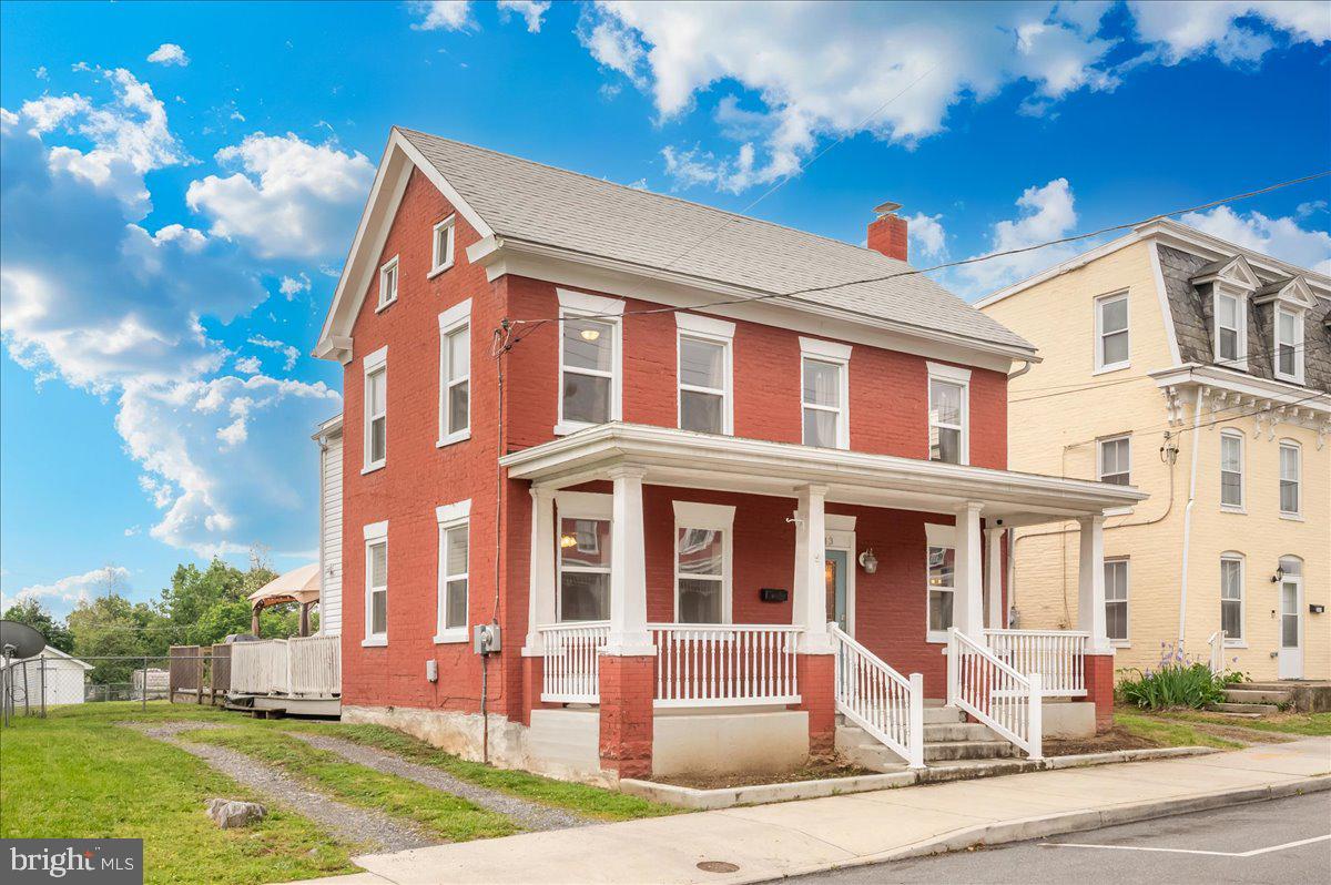 Step into timeless charm with this beautifully updated Colonial home in Hagerstown, originally built in 1881 and thoughtfully modernized for today’s lifestyle. Full of character and modern conveniences, this home offers the perfect blend of historic charm and contemporary comfort. The main level features a welcoming living room, formal dining room perfect for hosting gatherings, and a large modern kitchen with updated finishes and plenty of space to entertain. Upstairs, you’ll find three spacious bedrooms, including a private primary suite complete with its own full bath. Additional stair access leads to an attic area with drywall already installed, offering endless potential to be finished into a home office, playroom, bonus room, or additional living space. Outside, enjoy a sizable backyard complete with a deck — ideal for summer cookouts, relaxing evenings, or entertaining guests. The property also features a large detached garage offering excellent space for storage, a workshop, or the perfect setup for working on a vehicle or classic car. Conveniently located close to commuter routes, shopping, and directly across the street from Fairgrounds Park, this move-in ready home combines location, space, and charm all in one.