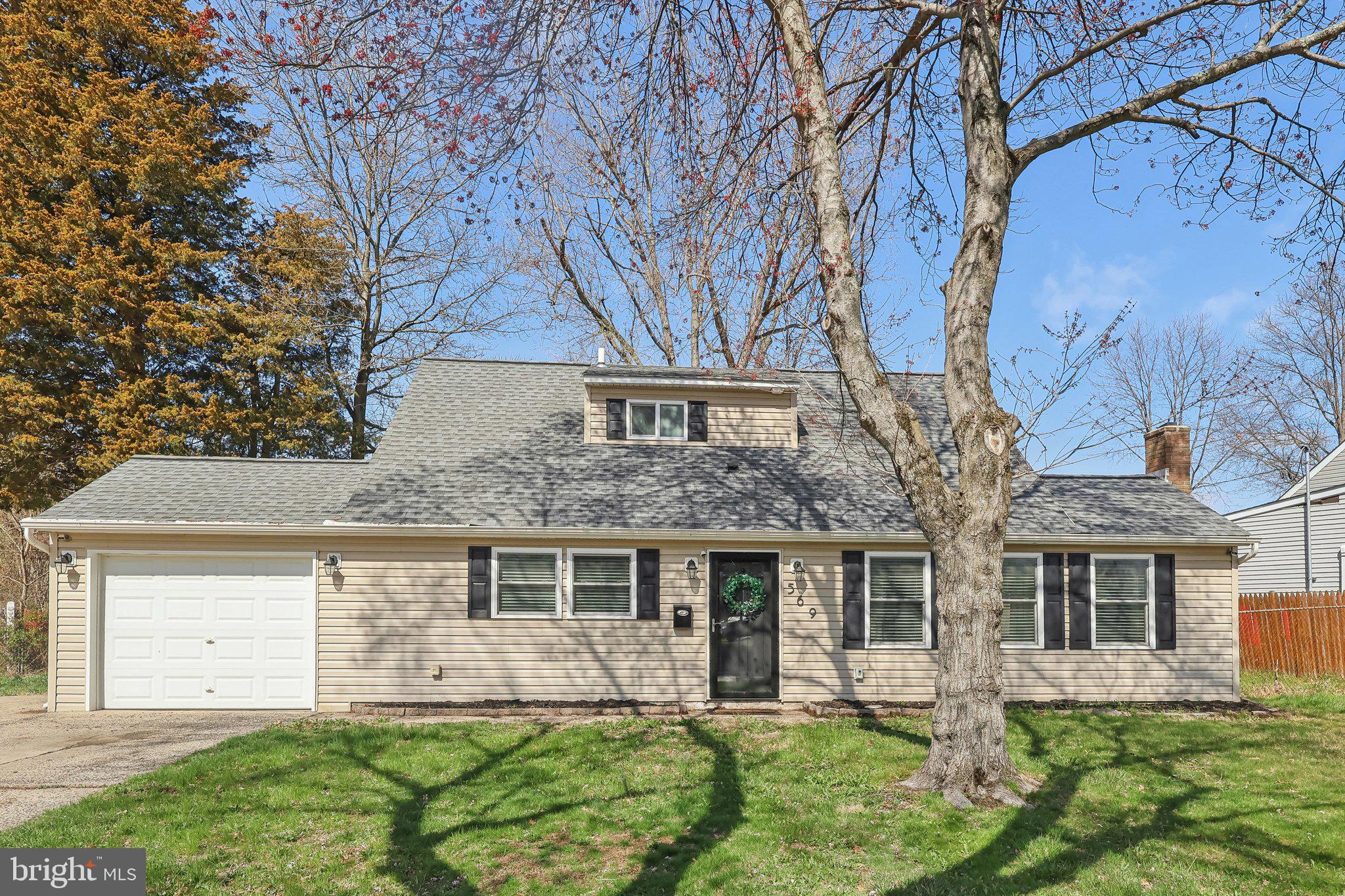 Welcome to this stunning, fully updated Cape Cod in the heart of Morrisville Boro! This charming home features an open-concept living area that seamlessly blends style and comfort. As you enter, you'll be greeted by luxury vinyl plank flooring that flows through the spacious living room and beautifully renovated kitchen. The eat-in kitchen is a true standout, boasting white shaker cabinets, gorgeous granite countertops, a chic tile backsplash, stainless steel appliances, and a convenient pantry. The living room offers plenty of natural light through several windows and is centered around a cozy brick-faced wood-burning fireplace – perfect for relaxing evenings. Sliding glass doors lead you out to a covered rear patio, where you can enjoy a large, flat backyard – ideal for outdoor gatherings or simply unwinding. On the main level, you'll find two generously sized bedrooms that share a beautifully updated full bathroom with a subway-tiled tub/shower combo. A laundry room with a stackable washer and dryer completes this level for added convenience. Access to the 1-car attached garage with a large storage closet and oversized driveway is located off the kitchen. Upstairs, two more spacious bedrooms offer plenty of privacy, and they share the second full hall bathroom, which features modern finishes. This home is ideally located, just moments from supermarkets, restaurants, parks, and all the amenities you need. With easy access to Route 1, I-295, and New Jersey, commuting and exploring the area couldn’t be simpler. Don’t miss the chance to make this beautifully updated Cape Cod your own!