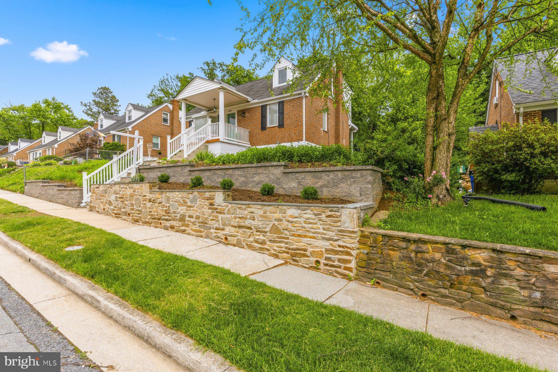 Welcome to 409 Oak Court — a beautifully fully renovated home on a charming street in Catonsville, ready for its next chapter and new memories to be made.

Located in the Hillcrest School District, this lovely home offers 3 bedrooms and 3 full bathrooms, with thoughtful updates and inviting spaces throughout. The top floor features an incredible primary suite complete with a massive walk-in closet — a rare find in Catonsville — along with a beautifully designed private bathroom that feels like a retreat. The suite also includes a non-accessible sliding door, offering the opportunity for future owners to build a private second-story deck that would feel like you were in a treehouse.

The main level offers two bedrooms and an updated full bathroom giving the primary privacy. While the tasteful kitchen overlooks the beautiful backyard, making everyday living feel special. Enjoy making your morning coffee at the built-in coffee bar, gathering in the spacious family room, or head downstairs to the fully finished walkout basement with an additional full bathroom — perfect for entertaining, hosting guests, or creating extra living space.

Step outside to a gorgeous backyard and stone patio that create the ideal setting for both entertaining and relaxing — from summer cookouts with friends to peaceful mornings spent sipping coffee.

Additional updates include a new HVAC system, hot water heater, and a newly built retaining wall in the front yard, adding both beauty and functionality to the home.

Just a short drive — or an easy stroll — from downtown Frederick Road, you’ll enjoy everything Catonsville has to offer. Spend your summers enjoying live music at Frederick Road Fridays, browse the Sunday morning farmers market, dine at family-owned restaurants, visit the local library, explore scenic hiking trails, and celebrate at the beloved Fourth of July parade — all while enjoying the vibrant small-town charm that makes Catonsville so special.