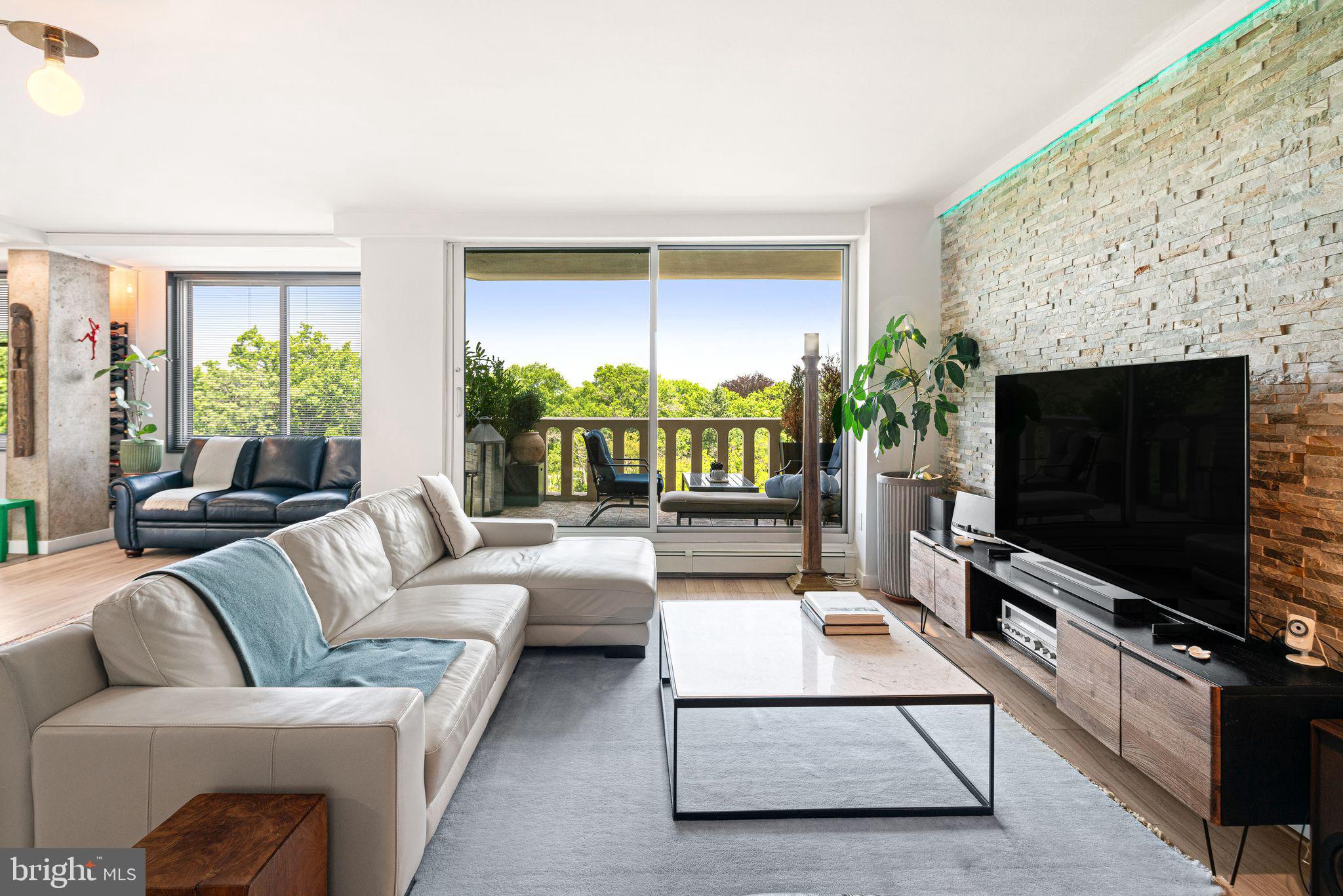 Welcome to 191 Presidential Blvd #630, a beautifully renovated 1-bedroom, 1-bath residence offering sophisticated style, exceptional convenience, and resort-style amenities in the heart of desirable Bala Cynwyd. From the moment you step inside, you'll appreciate the expansive open layout, where wide-plank flooring, designer finishes, and oversized windows fill the home with natural light while showcasing peaceful treetop views from the private balcony. The spacious living and dining areas flow seamlessly together, highlighted by a stunning stacked-stone accent wall that creates a striking focal point for entertaining or relaxing at home.

The recently updated kitchen is both elegant and functional, featuring sleek quartz countertops, abundant custom cabinetry, a wine cooler, stainless steel appliances, a large peninsula with seating, contemporary black fixtures, and ample prep space for everyday living or hosting guests. A rare and highly sought-after in-unit washer and dryer—a feature not commonly found in this building—adds unmatched convenience, while the generously sized bedroom provides a tranquil retreat with ample space for a sitting area or home office. The beautifully renovated bathroom boasts luxurious marble-inspired tile, a glass-enclosed walk-in shower, and modern vanity finishes that create a spa-like atmosphere.

Step outside onto your private covered balcony to enjoy morning coffee, evening sunsets, or simply take in the peaceful green surroundings. This home also includes a dedicated parking space in the garage and a separate storage unit, providing both comfort and practicality.

Residents of this full-service community enjoy an impressive collection of amenities, including valet parking, a 24-hour concierge, outdoor swimming pool, tennis courts, fully equipped fitness center, game room, additional laundry facilities, weekly car wash, and beautifully maintained common areas designed for easy, carefree living.

Ideally situated just minutes from Center City Philadelphia, Suburban Square, City Avenue shopping and dining, the Bala Cynwyd Trail, and major highways, this turnkey condominium offers the perfect blend of luxury, convenience, and low-maintenance living. Whether you're looking for your next home or an elegant lock-and-leave lifestyle, 191 Presidential Blvd #630 is a rare opportunity you won't want to miss.