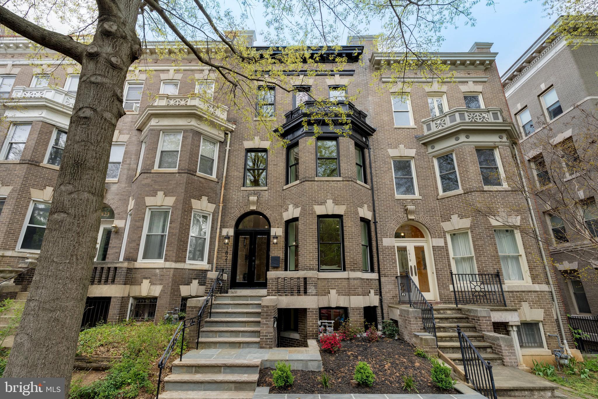 PRICE IMPROVEMENT!!! 5 STARS!!!   
Welcome to 1821 Wyoming Avenue Northwest, a stunningly renovated Georgian bayfront residence situated in the heart of Kalorama, Washington, DC. This exquisite home offers 4,010 square feet of meticulously designed living space spread over four levels, perfect for both grand entertaining and elegant everyday living.

As you enter, you'll be captivated by the main level's open layout, which seamlessly connects to a spacious patio and flat rear yard—ideal for hosting gatherings with ease. The southern exposure bathes the space in natural light, highlighting the home's remarkable features, including the beautiful coffered ceiling in the dining room and a chef's delight custom kitchen with integrated cabinetry.

This sophisticated home boasts five luxurious bedrooms and four and a half bathrooms. The primary suite is a true sanctuary with a stunning wet room featuring a soaking tub and separate shower. The top floor hosts a family room complete with a wet bar, leading to a wonderful roof deck that offers an inviting retreat.

The lower level in-law suite, accessible from both the main house and through private front and rear entrances, provides versatility as a potential income-generating space. Spectacular new wood flooring, including a herringbone pattern on the main level, adds to the home's modern charm.

Additional amenities include efficient air conditioning, a cozy fireplace, and a versatile basement. The property also features a detached garage equipped with heavy up electrical—perfect for electric vehicle enthusiasts.

Located just a short walk away from vibrant restaurants, entertainment, parks, and METRO, this home offers an unparalleled urban living experience. Discover this gem in one of DC's most sought-after neighborhoods and make it your own.