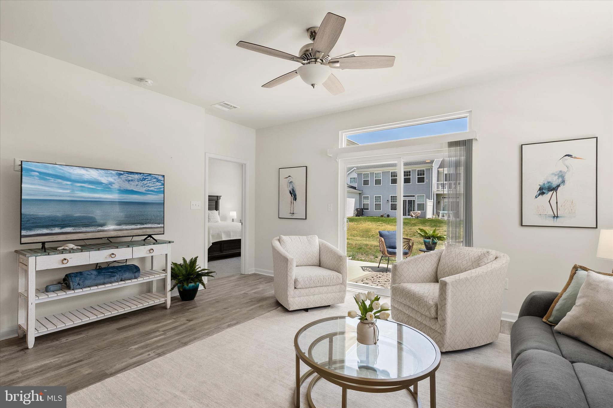 This beautiful 4 bedroom, 2.5 bath coastal style end unit villa is move in ready and set to be enjoyed for Summer 2026. In addition to the home being sold mostly FURNISHED, the seller is offering a $10,000 credit! Situated on a desirable corner homesite, this home offers low maintenance living with lower condo fees. The first floor features an open-concept layout designed for gathering and everyday living, highlighted by a spacious kitchen with a large island, stainless steel appliances, and granite countertops, A separate dining area provides additional space for hosting, while the first-floor primary suite includes a walk-in closet and private bath. Upstairs, you will find a versatile loft area, three generously sized guest bedrooms, and a full bath. The home also includes a two-car garage, adding everyday convenience and extra storage for all your beach gear.  Step outside to a concrete patio, perfect for enjoying quiet evenings after a day at the beach. Located just minutes from Bethany Beach and Fenwick Island, Friendship Creek offers convenient access to coastal dining, shopping, local attractions, and nearby beaches and bays. The community features an outdoor pool and dog park, adding to its appeal for both year-round living and seasonal enjoyment.
