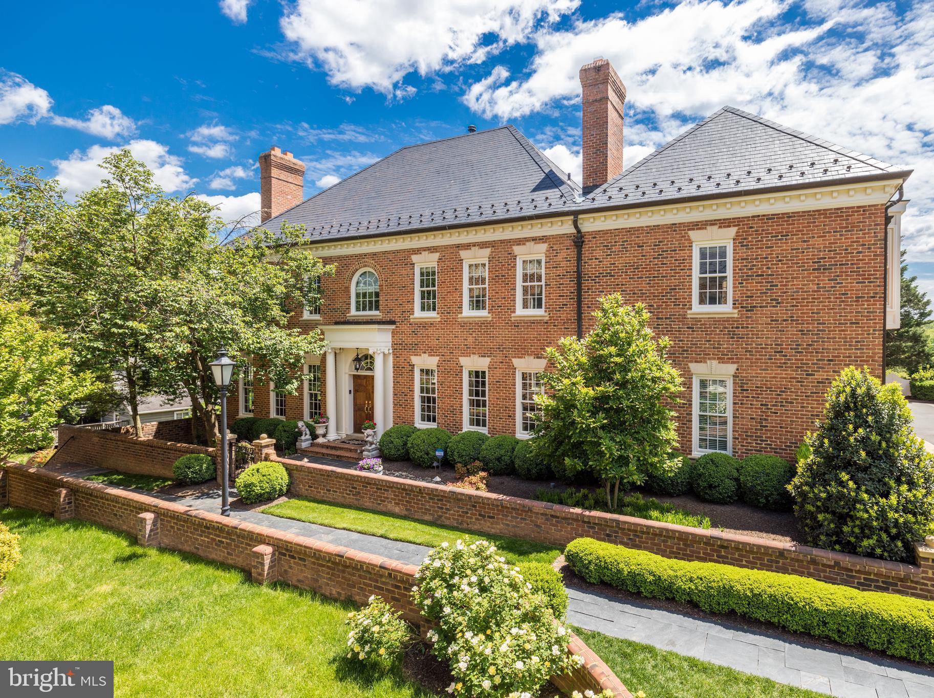 Luxury Townhouse with Elevator in the Heart of McLean  * Beautiful end unit with Georgetown brick patios, waterfall feature and built-in firepit feature *  Top of the line finishes throughout * Gourmet kitchen with onyx countertop, Viking stove, Sub Zero and Miele built-in coffee station. French doors from breakfast nook to beautiful courtyard * High ceilings, marble foyer and luxury owner suite with fabulous steam shower and coffee bar. Walkout lower level has a main living area with a gas fireplace, full bar for entertaining, and two sets of French doors that open to a beautifully landscaped terrace. The terrace features a calming waterfall and elevated gas fire pit. * Completing this level are: Home Theater with Sound Insulated Walls , Audio Visual Equipment with In-Wall 89" 4K HD Flat Screen TV * Temperature Controlled Wine Cellar with 400-500 Bottle Capacity * Other Home Features: Four Gas Fireplaces * 2021 All New Windows * MerryHill is a private enclave of elegant townhouses surrounded by a brick wall and lush landscaping *