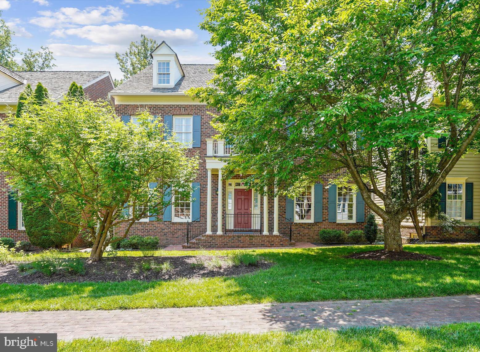Prepare to be amazed… A HOME OF DISTINCTION... Quality in the details.  Craftmark Rosewell model with custom features throughout, in the cloistered community of Williamsburg Commons.  This is a private enclave where you can enjoy an exquisite life & a unique sense of belonging.  Hard to believe you’re just a short walk to the Vienna Metro.  This elite gated community is a well-kept secret:  38 homes are thoughtfully sited around a colonial-style green, encouraging a sense of community.  Each home is unique and curated to perfection.  … Enjoy the freedom to turn the key and leave on vacation, confident in the security of your home, nestled in this elegant leafy gated retreat.  A sense of tradition envelopes you as you pass through the transomed front door with sidelights into a welcoming Foyer. With exquisite architectural details, this home exudes quality and attention to detail. Deep Crown molding and gleaming hardwood flooring span 2 levels. A columned Living Room overlooks the green and is open to the formal Dining Room where a 2-tiered chandelier will cast a warm glow on your dinner parties, while art spotlights throughout the home will showcase your collection. The gourmet kitchen will impress the most discerning chef with an abundance of cherry cabinetry, the granite countertop providing seemingly endless prep space, & the copper backsplash creating a stunning ambiance. The pantry is outfitted with an organizing system and easily holds all the ingredients for your next dinner party. The Kitchen is well-appointed with high-end SS appliances... a Viking 6 burner Gas range with grill and range hood and a Sub Zero built-in refrigerator. A wine cooler stores a selection of wines from your lower level wine cellar (about 2,200 bottles!).  The Family Room is stunning, presenting a gas fireplace with a handsome mahogany surround. Art spotlights showcase your favorite pieces. A main level Study offers a quiet spot to look out over the green to catch up on some work. An elegant Powder Room completes the main level. Two staircases ascend to the upper level, one from the foyer & a private staircase from the Family Room. The upper level offers crown molding & hardwood flooring. The spacious landing is an ideal reading nook or gallery space. An enormous Primary Suite with Sitting Room, Dressing Room & 3 walk-in closets with organizers creates a private retreat. The Primary Bath is spa-inspired & exudes quiet luxury, offering a boutique-style triple mirrored entry, walk-in shower, soaking tub, 2 cherry vanities and a private water closet. There are 3 spacious ancillary Bedrooms (2 with walk-in closets). One enjoys a private Bath and 2 share a Jack 'n Jill Bath. The windowed Laundry Room rounds out the upper level. The expansive lower level offers a large Rec Room, Game Room, Den/Guest Room with walk-in closet (with organizer), attached Full Bath and (the piece de resistance!) Wine Cellar. Enter the Wine cellar through a stunning winery-style wood door to walls of redwood racking for approximately 2,200 bottles. A central tasting table with even more redwood racking is adorned with a granite top. The room is cooled so your wine is properly stored to age so you can grab the perfect bottle for every occasion.  There is more than ample storage space reserved and plenty of shelving for all your seasonal items. Outdoors you’ll find perennial gardens, a brick Patio & a community green lined with trees, garden beds & charming garden benches. The community also enjoys a pool & pool house. The cloistered community of Williamsburg Commons, a private enclave where you can curate life on a higher plain.  Hard to believe you're just a short walk from the Vienna Metro, Tysons & easy commute to DC and Dulles International Airport.   Oakton High School.  Live life as it was meant to be enjoyed!