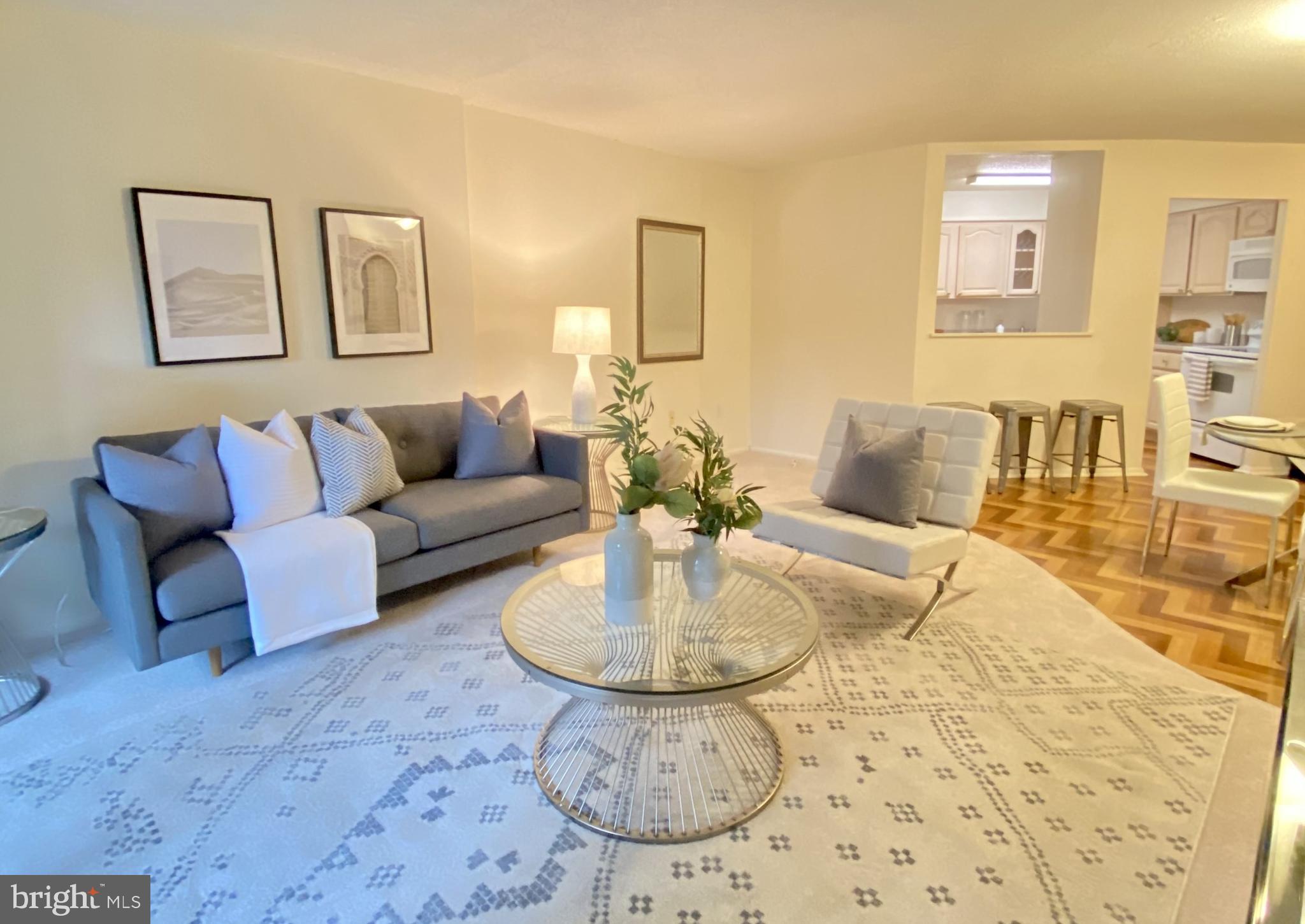 Spacious and light filled one bedroom, one and half bathroom with terrace showcasing sunrise city views at Academy House! Enter through a foyer with coat closet into the sun-drenched great room with ample space for living, dining, and entertaining. The living area provides access to the private terrace, perfect for enjoying a morning cup of coffee or dining al fresco. The updated kitchen enjoys ample wood cabinetry, solid surface countertops, a full suite of appliances, wood floors, and a passthrough overlooking the great room. The spacious bedroom features excellent closet space, access to the terrace, and an ensuite bathroom with large wood vanity, tub shower, designer tilework, and laundry closet with stacked washer/dyer. Additional home highlights include custom herringbone hardwood floors in the bedroom, dining area, and foyer; a conveniently located powder room in the foyer; and excellent storage space throughout. Residents of Academy House enjoy a 24-hour doorman and a  state-of-the-art fitness and aquatic center. There is valet parking in the building's garage for an additional monthly fee, subject to availability.  The Academy House is located in the heart of Center City and within close walking distance to Rittenhouse Square, Washington Square, and the Broad Street and Market Street office corridors. The Philadelphia International Airport and Amtrak's 30th Street Station are easily accessible.