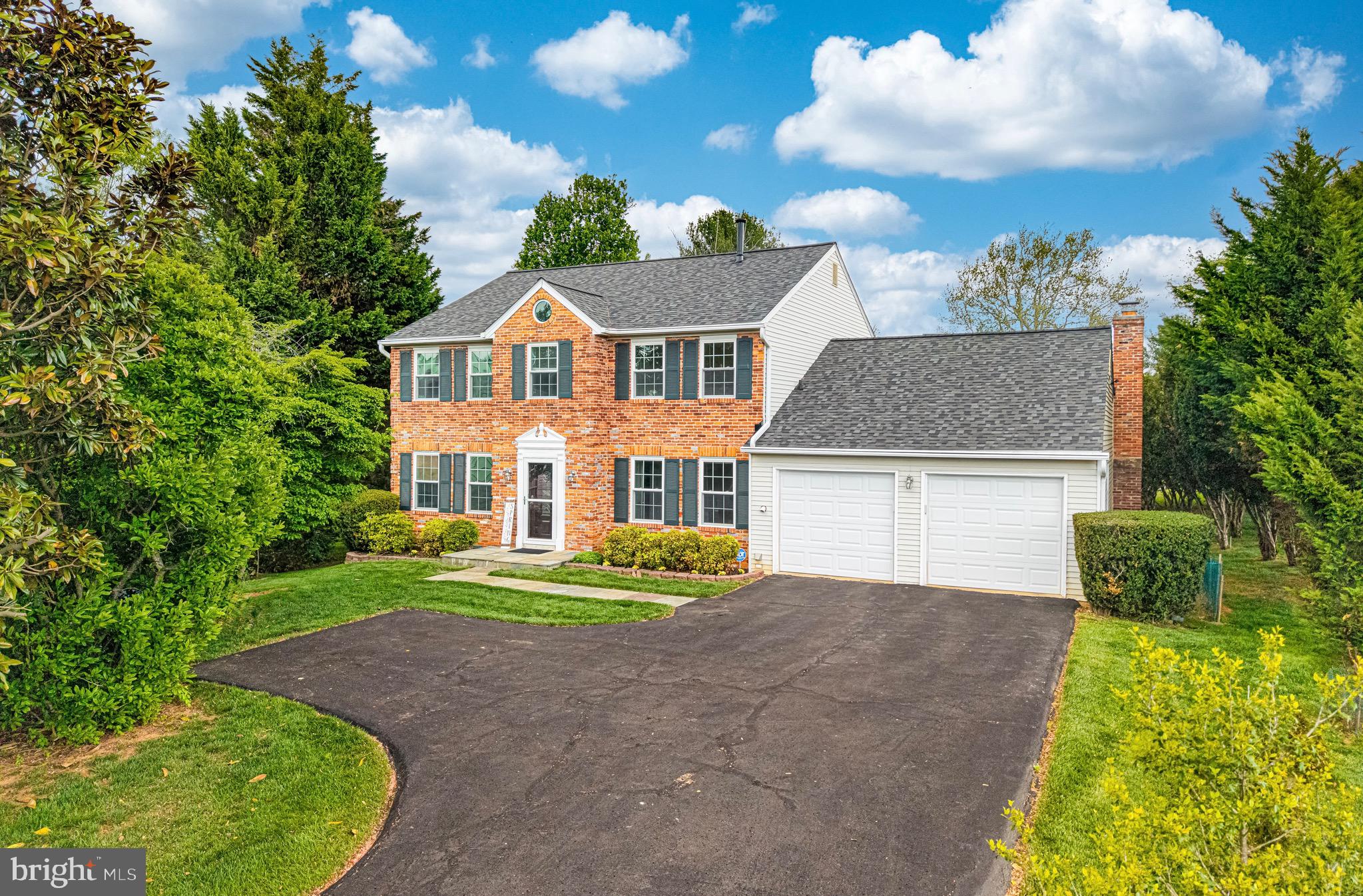 Open House Cancelled. Beautifully maintained classic brick center-hall Colonial in the highly sought-after Derwood Station community, offering the largest floorplan in the neighborhood with approximately 3,684 square feet of interior space. From the moment you arrive, you’ll be impressed by the expanded driveway with parking for 4+ cars, the elegant flagstone walkway and front stoop, and the custom-crafted solid mahogany front door.

Inside, rich wood flooring spans all three levels, offering a clean, carpet-free interior, while abundant natural light fills the home through large energy-efficient replacement windows, skylights, and upgraded glass patio doors. The classic center-hall Colonial layout offers a functional and elegant main level, featuring a home office or bedroom to the right of the foyer, a spacious living room to the left, flowing into an elegant dining room beyond, enhanced by a bay window. The updated eat-in kitchen showcases maple cabinetry, granite countertops, updated appliances, gas cooking, and a vented range hood. The breakfast area, also featuring a bay window, opens seamlessly to an expanded family room centered around a brick-surround wood-burning fireplace, creating a warm and inviting gathering space. A sliding glass door leads to a deck overlooking a peaceful, tree-lined backyard canopy—perfect for relaxing or entertaining. Upstairs features a spacious primary suite with a large walk-in closet, three additional well-sized bedrooms, a hall bathroom with dual vanities, and a generous linen closet. A convenient laundry chute connects the upper-level bedrooms directly to the main-level mudroom laundry for added everyday ease. The walk-out lower level is fully finished and ideal for entertaining or multi-generational living, offering a spacious recreation room with a wet bar/kitchenette, a full bathroom, a versatile bonus room (perfect for a guest room, gym, or media room), and a large utility/storage room.

Additional highlights include: the entire home freshly painted (2026); an excellent groundwater management system professionally designed and installed by Gray Goose Farm (Gaithersburg); custom gutters with LeafGuard system, installed through Costco (2015); a brand-new architectural roof installed in October 2025 using Owens Corning Duration® AR shingles, offering enhanced durability, wind resistance, and algae protection; a professionally maintained high-efficiency Carrier HVAC system with humidifier (replaced in 2020); a 50-gallon gas water heater professionally installed in 2019 and WSSC-inspected; a professionally installed whole-house Flow-Tech inline water treatment system (2021); three solar-powered attic fans to help reduce attic heat; and additional insulation installed in the attic and garage roof for improved energy efficiency.

Ideally located just minutes from Shady Grove Metro Station, Interstate 270, and Rockville Pike, this home offers exceptional convenience for commuting, shopping, and dining. Nature lovers will appreciate being less than a 30-minute walk to Lake Need​wood via a walking trail with direct access from the side yard.