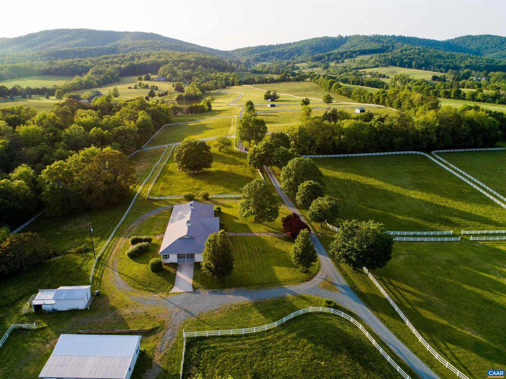 60+/- private acres of rolling open minutes to town, across from Keswick Hall.  A beautiful parcel with panoramic views of the SW Mountains and surrounding farms.  The property comes with three development rights and is a strong candidate for a conservation easement.  Excellent infrastructure including a small farm house, center aisle stable, pony barn, multiple paddocks and run-in sheds, riding ring and a good road system. Numerous exceptional building sites.