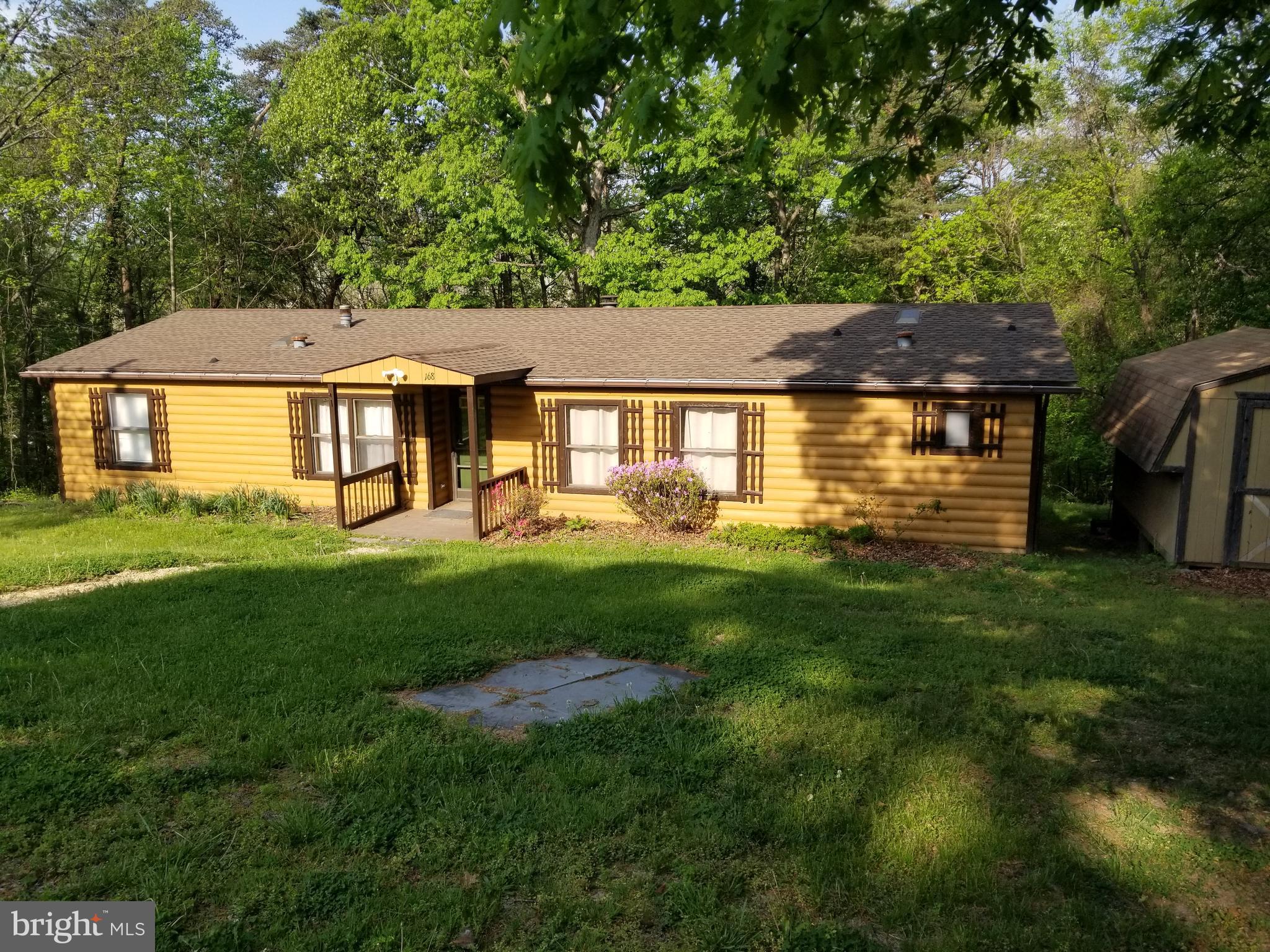 BACK TO ACTIVE PENDING RELEASE!!
2-3 BEDROOM,  2 BATH ranch style manufactured home in the Harpers Ferry District offers a private setting on 4 lots = nearly a half acre.
A structural stabilization and modification  was very recently performed by a professional engineering group and inspected and certified by the Jefferson County Engineering Department.
Many upgrades include:  New appliances in 2021, all of which convey,  New HVAC system in 2022,  New roof in 2025,  hot water heater in 2021,  updated wiring and electrical system and LVP flooring.
Other amenities include skylights,  a wood burning fireplace,  public water,  a private septic system 
and a screened-in back porch.  CASH OR STRONG BANK INVESTOR. GREAT RENTAL PROPERTY!!