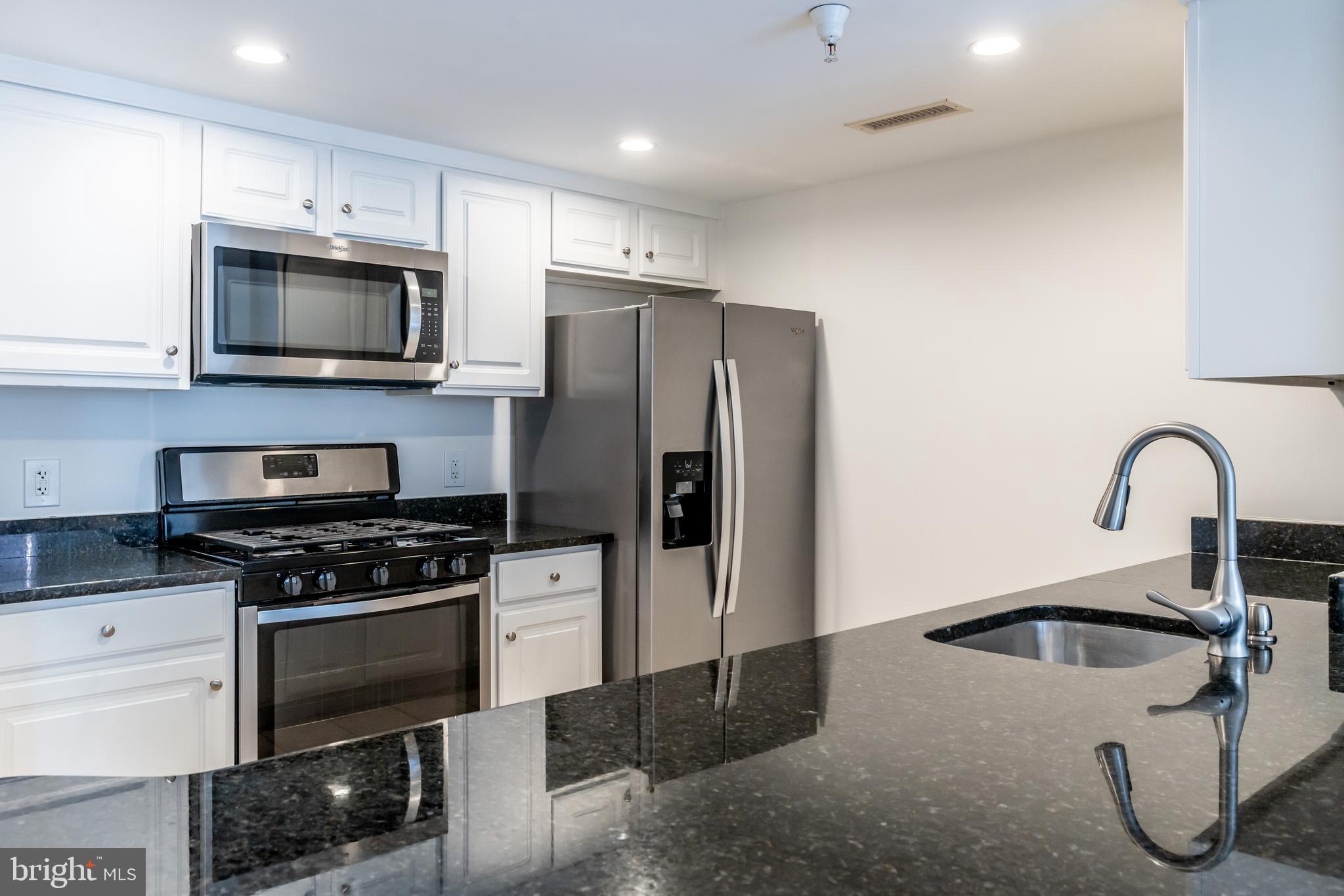 OPEN 5/24 FROM 1-4PM
NEW PRICE...hurry!! Welcome to The Gallery, a highly desirable building and neighborhood. Conveniently located near major shopping and restaurants, it's across the street from Pike and Rose! Walk to the North Bethesda Metro stop. It's also close to Wegmans grocery store and the Gourmet Giant as well as Rockville Pike's largest open-air shopping area.

This unit features an open floor plan that is spacious and bright, thanks to an oversized balcony allowing plenty of air and light in. Enjoy brand new beige wide-planked engineered vinyl floors throughout. The large bedroom has a generous closet with shelving, along with a recently updated bathroom featuring new light fixtures, mirrors, hardware, and refinished tub.

The kitchen boasts newer stainless appliances, refinished cabinets, all installed 2-3 years ago. For added convenience for residents, there is a stack washer/dryer in the kitchen area. Fresh paint covers the entire unit; the seller has taken care of everything for the lucky future buyers.

The building offers various amenities for residents such as a workout room, pool, library, and clubhouse for entertainment purposes. This premium 13th-floor unit faces towards the interior of the subdivision without any noise from Rockville Pike traffic while providing breathtaking distant views.