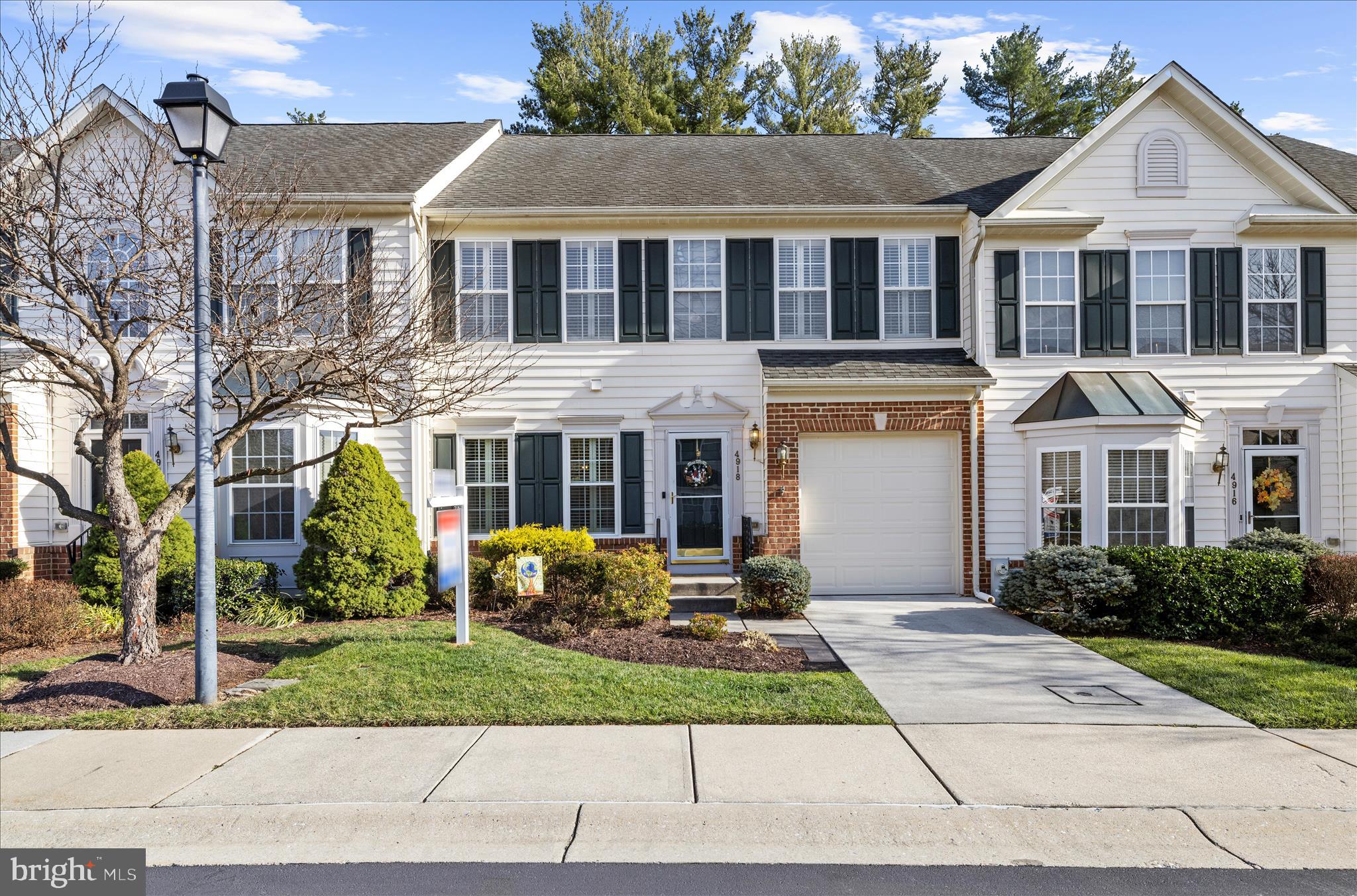 Come live the carefree lifestyle in this upgraded 55+ villa with a 1 car garage and the lowest monthly fees around!  This home is filled with great upgrades including gleaming hardwood floors, fresh neutral paint and 9' ceilings on the main level. The kitchen features 42" white cabinetry, granite countertops, a custom backsplash, stainless steel appliances and a sunny breakfast nook.  Entertain in the living/dining combo featuring impressive vaulted ceilings and a cozy gas fireplace.  The relaxing sunroom is sure to be your favorite spot for morning coffee or a good book.  The main level primary bedroom features a tray ceiling, walk-in closet and an upgraded primary bath with double sink/vanity and a walk-in shower.  A convenient laundry closet is located in the hallway just outside the primary bedroom.  Upstairs you will find two spacious bedrooms and a full bathroom.  The large loft is a versatile bonus space and the upper level storage area is great for holiday decorations and luggage.  The finished, lower level offers a huge recreation room with upgraded carpeting, a full bathroom and a utility room.  Recent updates include an insulated garage door in 2025, natural gas water heater in 2021, washer & dryer in 2021, main level windows in 2019, AC in 2019 and a kitchen remodel in 2018.  Lawn care, exterior building maintenance and snow removal are covered by the condo association.  This great home is tucked away on a dead end street but ideally located near many modern conveniences.
