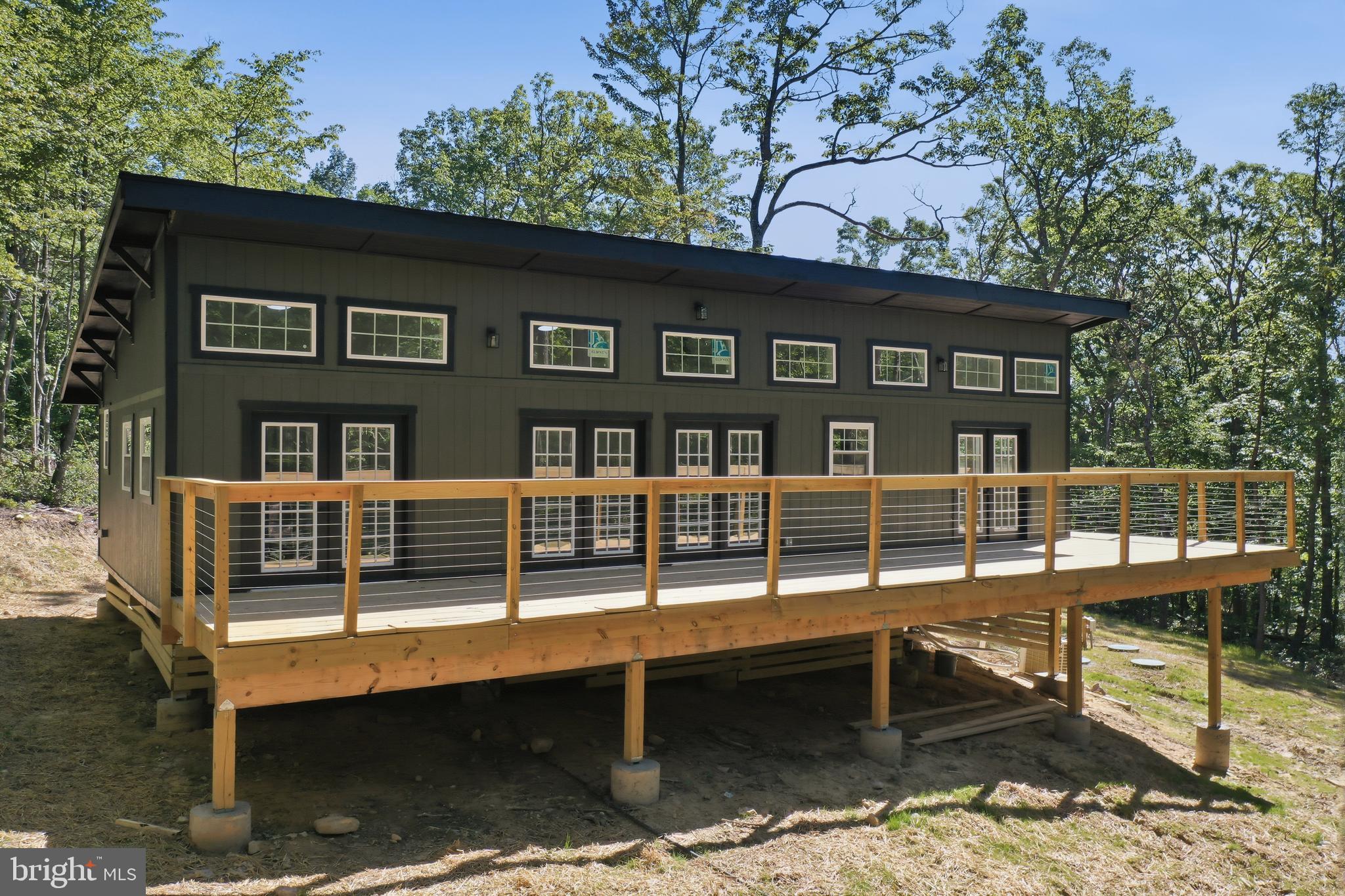 Newly Handcrafted Cabin in the Heart of the Shenandoah Valley

This beautifully handcrafted new cabin is perfectly designed as a short-term rental investment or private retreat. Featuring easy-to-maintain laminate flooring throughout, along with stylish bathrooms and a modern kitchen, this home combines comfort, convenience, and charm.

Relax among the trees on the spacious deck and enjoy the peaceful surroundings that make this property such a special getaway. Spend your days exploring everything the Shenandoah Valley has to offer, including hiking, tubing, fishing, and countless outdoor activities.

In the winter, enjoy skiing and snowboarding at nearby Massanutten and Bryce Resort. Explore the breathtaking Luray Caverns, visit local wineries, breweries, and pubs, or dine at the area's many excellent restaurants.

Whether you're looking for a vacation home, income-producing rental, or both, this exceptional property is an opportunity you won't want to miss.

Schedule your showing today and discover all that this outstanding investment property has to offer!