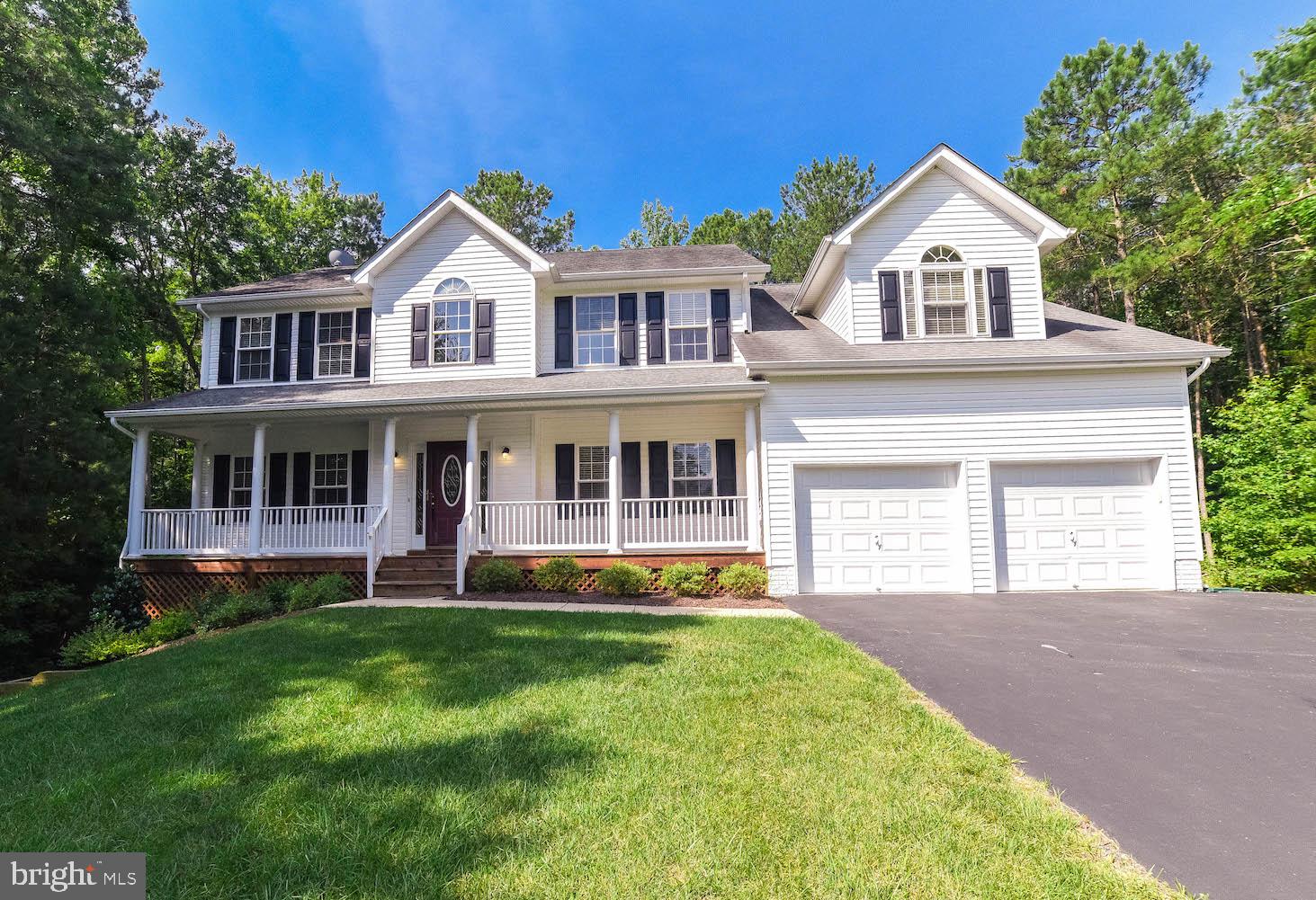 Beautiful Colonial situated on a 2 acre lot backing to trees.  This home has it all.  5 bedrooms, 2 1/2 bathrooms.   Foyer w/hardwood flooring opens to office/den and formal/living dining rooms.  Gourmet kitchen recently updated w/island, buffet and built in wine rack.  Kitchen/Breakfast area open to large Family Room w/hardwood floors and fireplace.  Sliders open to fabulous screened porch w/vaulted ceiling perfect for entertaining and peaceful evenings at home.  Mud room off kitchen w/access to garage and utility sink.   Basement has a finished basement, storage room, space for future bedroom and rough in for bathroom.  Community pool.  Close to schools, shopping and base.  Call CSS to show.