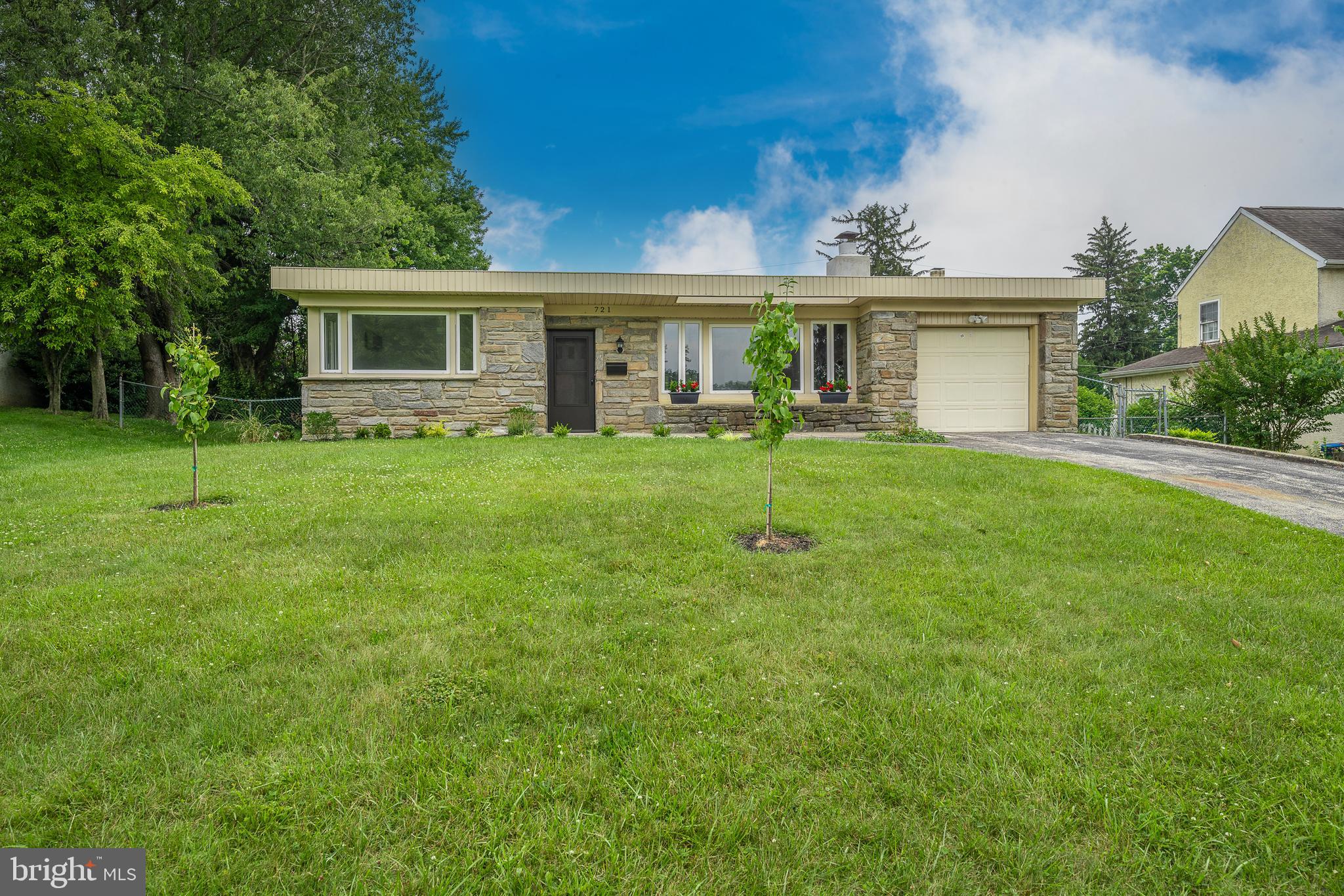 Available for rent July 1st is this well-maintained Stone rancher in the heart of Broomall! Situated on a flat-level lot, this home shows off a range of features that are sure to impress. As you approach the home, you'll notice the long driveway and beautifully manicured front yard, setting the stage for what awaits inside. Step through the front door and be greeted by the spacious and inviting living room. Recently upgraded with luxury vinyl plank flooring, it also boasts a striking full-stone wall fireplace and a large picture window that offers a charming view of the front yard. The formal dining room is perfect for hosting family dinners, complete with ample space and a convenient pantry for storage. The well-appointed gourmet kitchen is a highlight, featuring stainless steel appliances, a white tile backsplash, quartz countertops, and plenty of cabinet space. For added convenience, there's a discreet laundry room tucked away behind a custom barn door, complete with a washer and dryer. As you continue down the hallway, you'll find the sizable primary bedroom with a generous-sized closet. Two additional well-sized bedrooms provide flexible living spaces for family members or guests. The beautifully renovated full hallway bathroom offers modern finishes, stunning tile work, and a tub shower combo. Beyond the main living areas, an abundance of natural light fills the sunroom, accessible through French doors from the formal dining room. This sunroom features two ceiling fans and walls of windows, creating a bright and inviting space. Step outside through the Anderson slider onto the rear patio, where a flat backyard awaits, providing the perfect spot for outdoor activities and entertaining. Parking is a breeze with the convenience of a one-car attached garage and a long driveway! The home's location offers convenient access to I476, Route 3, Route 1, the Main Line, various schools, universities, shopping, and dining options. Schedule an appointment today!