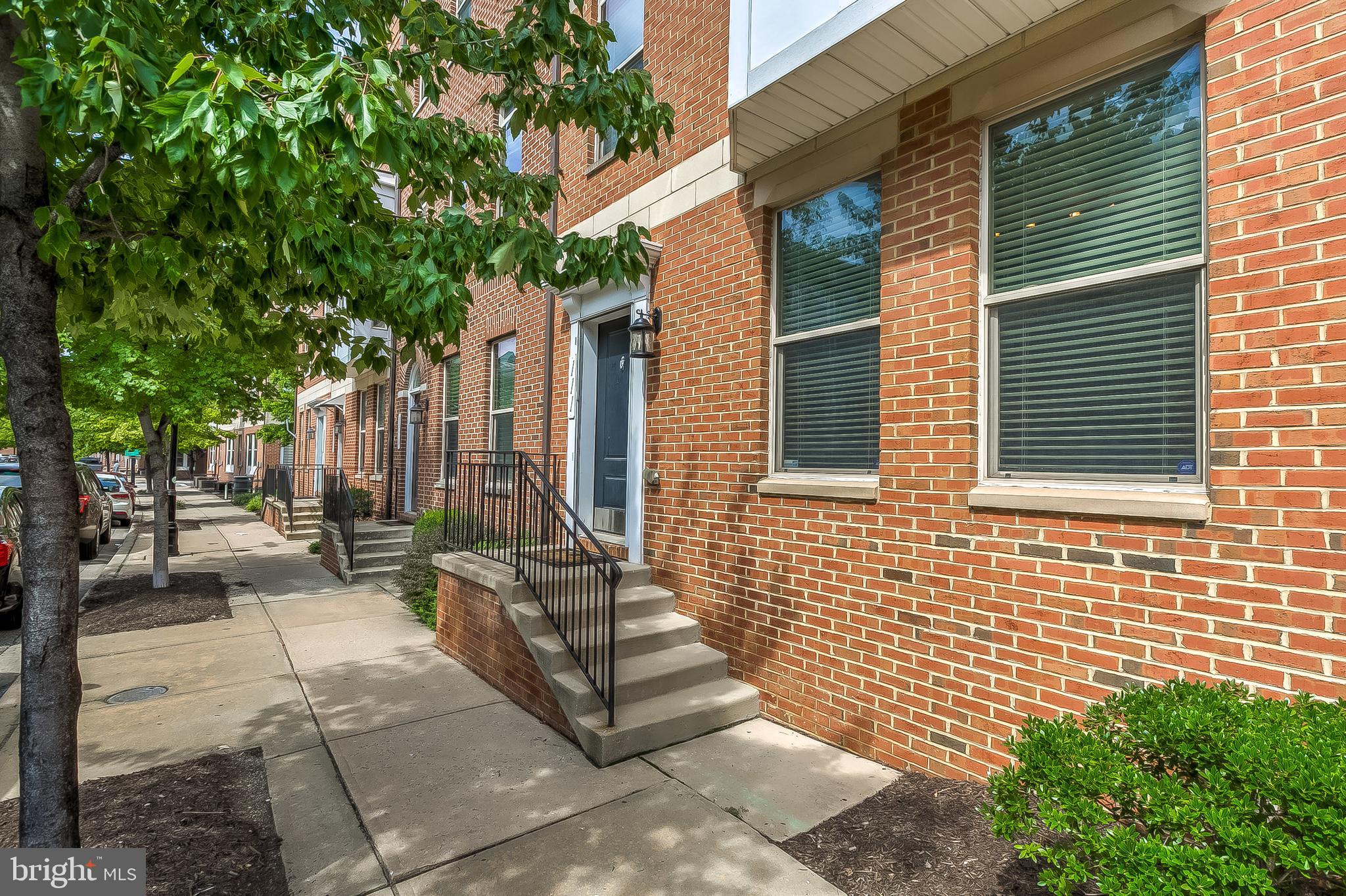 Park your cars in this home's 2 car garage and walk anywhere in Baltimore, from this fabulously convenient location. This home is 100% move in ready with a fresh coat of paint, new carpet, and new flooring on the entrance level. The open concept main living level is bright and inviting with hardwood floors, recessed lights, a half bathroom, a large hidden pantry, and access to a deck with low maintenance composite decking. The large master suite is a private oasis with a walk in closet, ensuite bathroom with a soaking tub and double sink vanity, a sitting area/ office space, and private balcony. The second bathroom is conveniently located in the hallway with easy access for occupants of the other two bedrooms. Entrance level is a fantastic flex space, perfect for a den, pool room, play room, office, or anything that suites your needs. 2 garage has additional storage space and can fit 2 additional vehicles in the parking pad behind the garage door. Fees include exterior maintenance of the structure (including the roof!) and grounds, sewer, and snow removal. Vacant property, so you can easily and safely view this property.