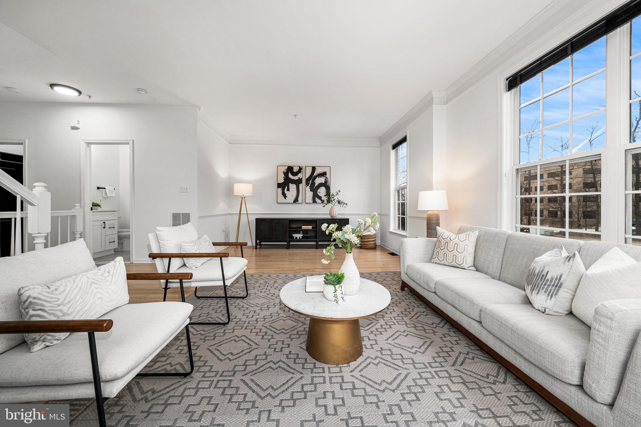 OFFER DEADLINE: Monday, March 2nd ,2026 by 3:00pmEST. Welcome to The Madison Park Residence, an updated end unit townhome filled with natural light and modern upgrades throughout. The main level opens to a spacious living room that flows into an inviting dining area with custom built-ins and a gas fireplace. The adjoining kitchen has been refreshed with quartz countertops, 42 inch cabinetry, stainless steel appliances, and plenty of storage, creating a comfortable and functional space for everyday cooking. A private terrace extends the main level outdoors, perfect for morning coffee or relaxing in the evenings.

Upstairs, the primary suite offers generous space, refinished hardwood flooring, and a beautifully renovated private bathroom. Two additional bedrooms on this level provide flexible options for guests, work from home needs, or hobbies, and the updated hallway bathroom features modern finishes and thoughtful design.
Recent improvements include fresh paint throughout, new LVP in the entryway, fully renovated bathrooms, refinished hardwood floors, and a newer washer and dryer. The home also includes a one car garage for added convenience.

Residents of Madison Park at West Market enjoy access to community amenities that include a pool, fitness center, clubhouse, sauna, tot lots, and a scenic pond. All of this is a short walk to Reston Town Center with quick access to major commuter routes and the Reston Metro.