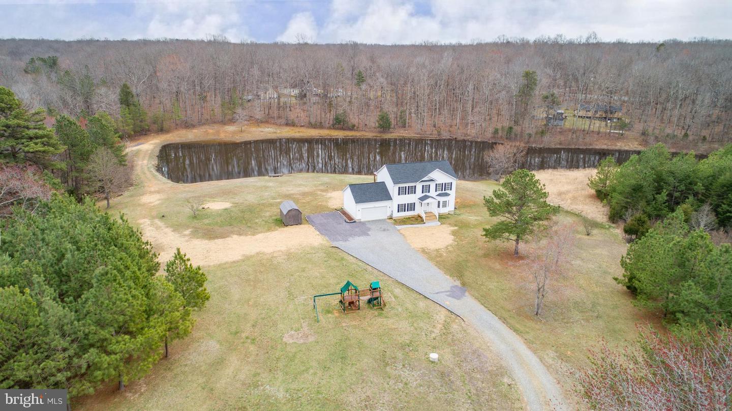 Private Oasis Close to Rt 3!!! 9.09 Beautiful Acres, Fishing Pond, Lots of Wildlife!!! Chickens will Convey with Property Also!!! This Home Offers 4 Bedrooms (Possibility of 5 NTC) 2.5 Baths ( Rough in on Lower Level for Another Full Bath).  Home is Completely Updated, Open Concept, All Windows to the back of the Home Overlook the Pond. Partially Finished Walk Out Basement with a Wood Shop/Tool Room,  Lots of Storage Space, Spacious 2 Car Garage, Pellet Stove, Energy  Efficient Heating and Cooling System and Beautifully Crafted Stone Fireplace.  20x20 Gazebo Overlooking the Pond.  Fruit Trees Planted Up and Down Driveway. Brand New 16x32 Above Ground Saltwater Pool. All Pool Equipment and Furniture Convey. Xfinity Run Lines for Highspeed Internet Great for Working from Home or Gaming.  A Playhouse is  Nestled in the Trees for the Kids to Play In.  Great Riding Trails Also!!!  Fully Stocked Fishing Pond with a Fountain.  Shed Conveys with Property Also.  A Must See for Price and Location!!!