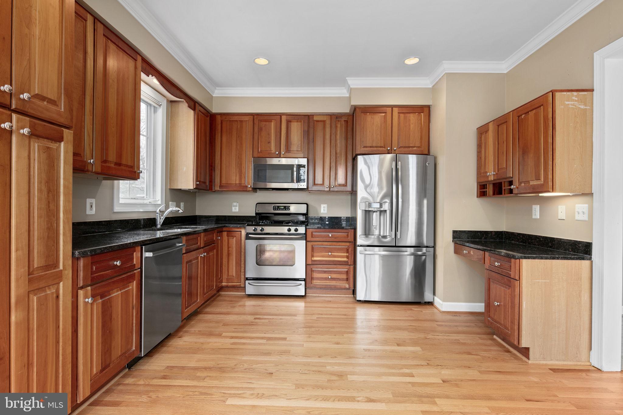 Built in 2004 in sought-after Arlington Science Focus/Dorothy Hamm/Washington-Liberty school pyramid, your new home starts with a charming front porch…Hardwood floors in the foyer extend throughout the main and upper levels. The architectural charm continues with 9’ ceilings and crown molding throughout the main level; living room with built-ins, ceiling fan, recessed lighting and a gas fireplace; and a large kitchen with windows on 2 sides, stainless steel appliances, gas cooking, recessed lighting, granite counters, cherry cabinets, built-in desk, table space and access to the rear deck. New blinds throughout. The upper level has two primary suites with skylights, lots of closet space, and a cozy hall nook for a desk or chair.  Laundry, with new washer and dryer, is also on the upper level! 2-system HVAC, fenced yard with Trex deck and patio, and 1 car garage. Terrific location: blocks to Virginia Square metro, Quincy Park, YMCA, and the shops, restaurants, and amenities of the Clarendon-Virginia Square-Ballston corridor! 1 block to Giant Food and 38B bus to Ballston metro and Farragut Square in DC. No cats; dogs case by case with substantial pet deposit.