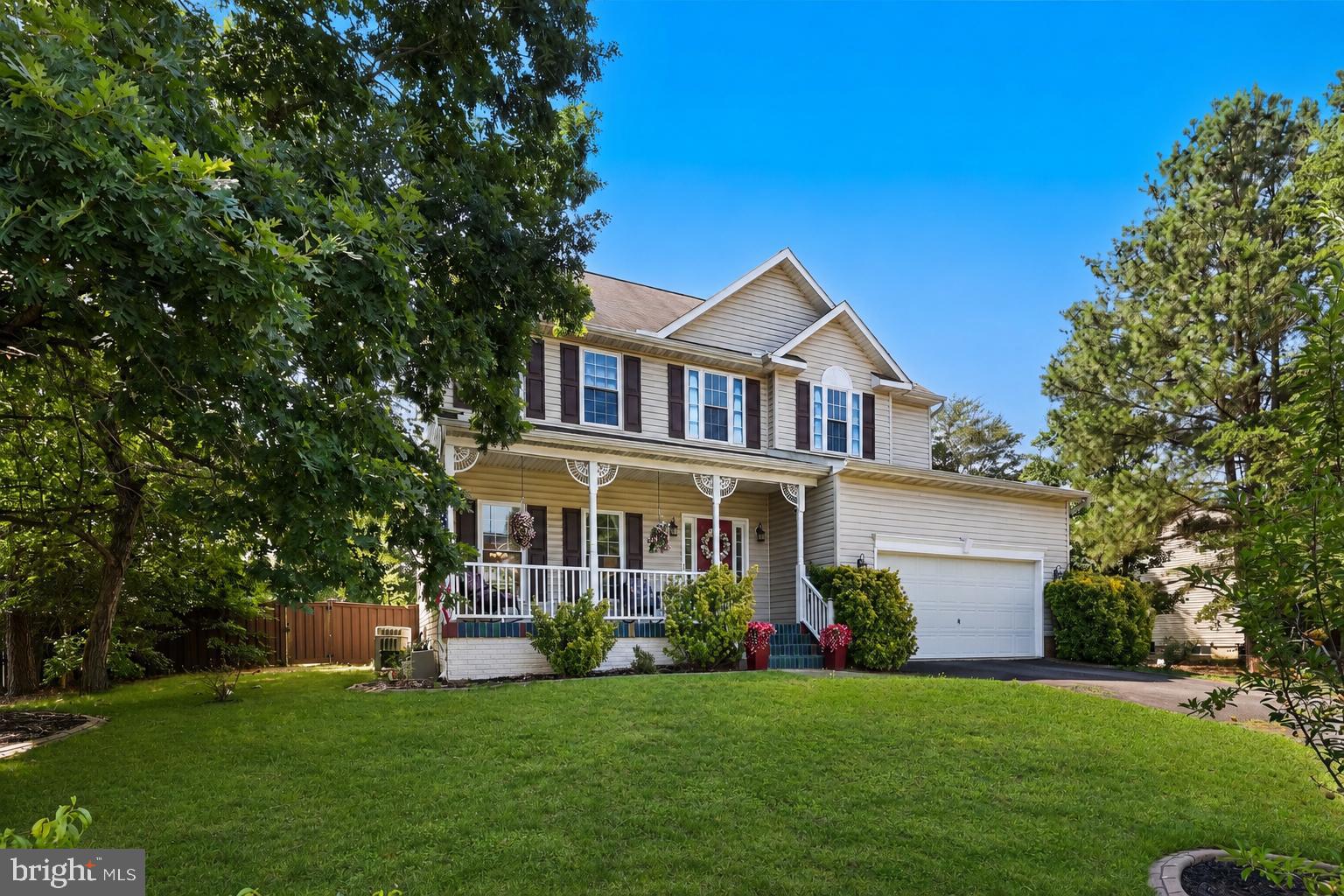 Welcome to this spacious three-level home offering over 4,000 finished square feet, thoughtfully designed for everyday living and entertaining. Set in a quiet neighborhood with no HOA, this home combines generous living spaces, valuable upgrades, and an unbeatable location just minutes from Dahlgren.  The main level features a bright kitchen with a sun-filled bump-out that has become a favorite gathering spot, offering direct access to the deck overlooking the huge Trex-fenced backyard. The kitchen is beautifully appointed with quartz countertops, stainless steel appliances, and a newer stove and microwave (both less than a year old). The adjoining family room is warm and inviting with a cozy fireplace, while the oversized dining room is perfect for hosting holiday dinners and special occasions. Upstairs, you'll find four spacious bedrooms, including a stunning primary suite with a vaulted ceiling, two walk-in closets, and a beautifully renovated en-suite bath featuring a newer walk-in shower. The conveniently located upper-level laundry room includes a washing machine that's less than a year old.  The finished walkout lower level offers exceptional flexibility with a massive recreation room, a fifth bedroom, a full bathroom, and an additional flex room ideal for a home office, gym, hobby room, or guest space. Outside, the expansive fenced backyard includes a storage shed, offering plenty of room for pets, play, gardening, or outdoor entertaining. Additional highlights include fully paid-off solar panels for energy savings and a whole-house generator, offering peace of mind year-round. The homeowners have especially loved the peaceful setting, the quiet neighborhood with no HOA, and the convenient commute to the Dahlgren base. This is a home that truly offers the perfect combination of space, comfort, efficiency, and location.
