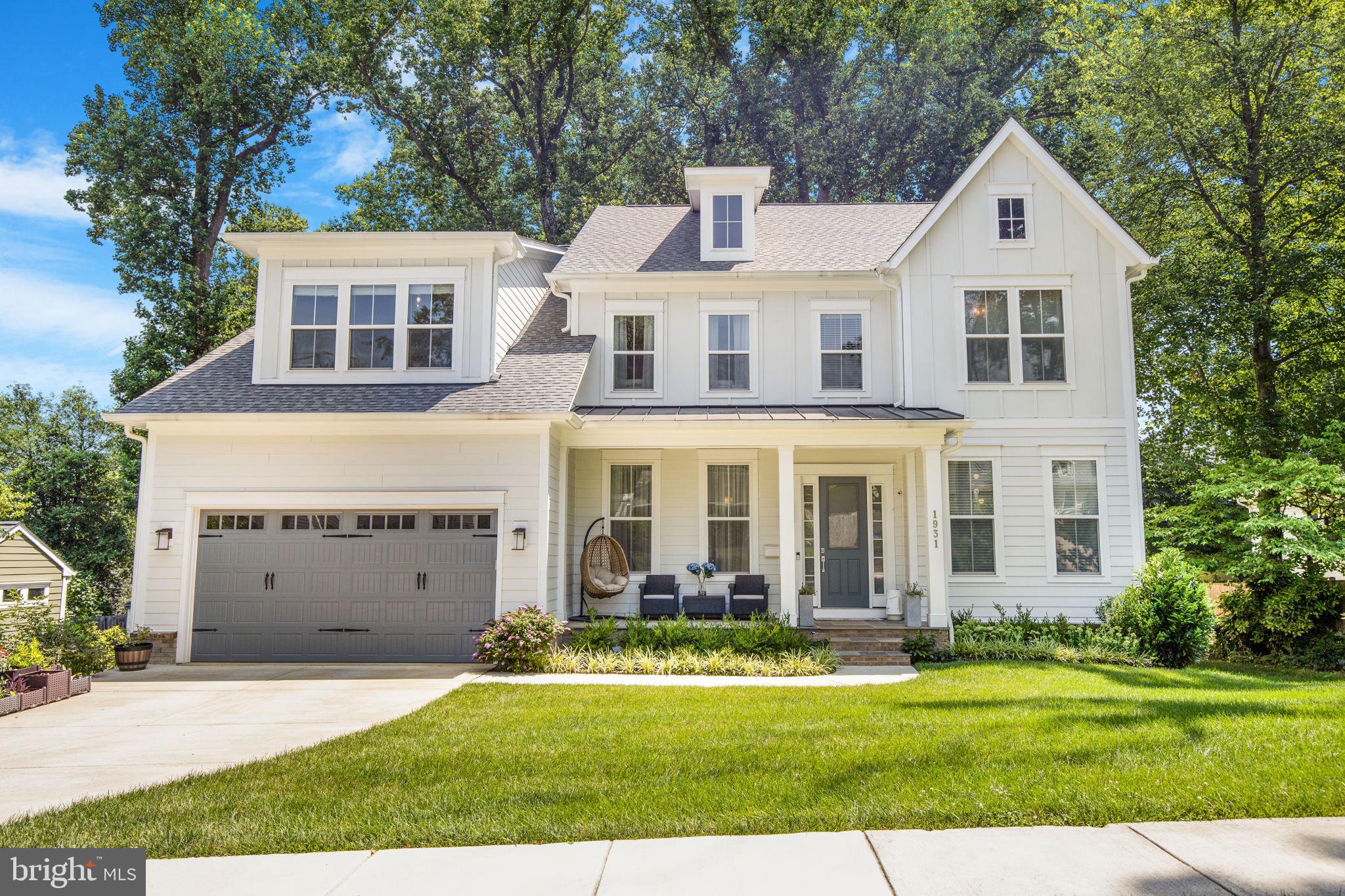 Pristine 6,500+ sq ft Stanley Martin modern farmhouse, custom designed blending upscale and natural materials. The durable Hardie Plank Board & Batten exterior adds rustic charm, while the inviting front porch evokes a classic neighborhood feel. Inside, soaring 10 ft ceilings and oversized windows (up to 7 ft tall) create bright, cheerful interiors. Specialty window treatments—including sheer horizontal shades, 2” faux wood blinds, and double-layer curtains—offer privacy and move-in-ready comfort. Wide-plank 5” engineered hardwoods run through the first and second floors.

Designer lighting and accessories elevate the home throughout. The chef’s kitchen features a large quartz island, marble tile backsplash with quartz counters, and cabinetry that extends into the eat-in space—perfect for entertaining. Full-height upper cabinets and a walk-in pantry with a window provide ample storage. High-end appliances include a GE Monogram gas stove, Samsung Bespoke fridge, Sharp drawer microwave, LG dishwasher, and GE double oven. A custom exhaust hood vents outside.

A rear deck and stone patio offer ambient lighting, and solar lights highlight the landscaped backyard, filled with fruit trees and flowering shrubs (see list). A butler’s pantry with wine fridge connects the kitchen and formal dining room. A main-level bedroom and full bath accommodate guests or a home office.

Upstairs, a loft living room provides a cozy retreat. The expansive owner’s suite includes a sitting room, dual walk-in closets, and a spa-like bath with a deep freestanding tub, oversized shower with Calacatta Bianco marble tile, and an 11 ft vanity with makeup desk. Three additional bedrooms and two baths—one ensuite, one with shared access—complete the level, all with Venetian marble vanities and tiled floors.

The walk-out lower level feels above ground with abundant windows. Ideal for an in-law or au pair suite, it features a massive rec room, game room, 6th bedroom or office, 5th full bath, and a mini kitchen with wet bar—perfect for entertaining.

The spacious two-car garage includes room for tools and toys. Landscaping features flowering and fruit trees, plus a “Green Giant Arborvitae” hedge that will mature into a 30’ privacy screen. The home is HERS-rated with a Smart Trane HVAC system. A 2-10 Home Warranty covers systems and appliances through 8/26/2027, and structural components through 9/12/2032.

Prime location near Silver Line McLean and Orange Line West Falls Church Metro stations, with easy access to I-66, I-495, and the Dulles Toll Road. Enjoy performances at Capital One Hall, shop at Tysons Galleria, and pick up groceries at Trader Joe’s, Wegmans, and Safeway. Idylwood Plaza offers Starbucks and more. Located in the sought-after Marshall School Pyramid.

Come see it today!