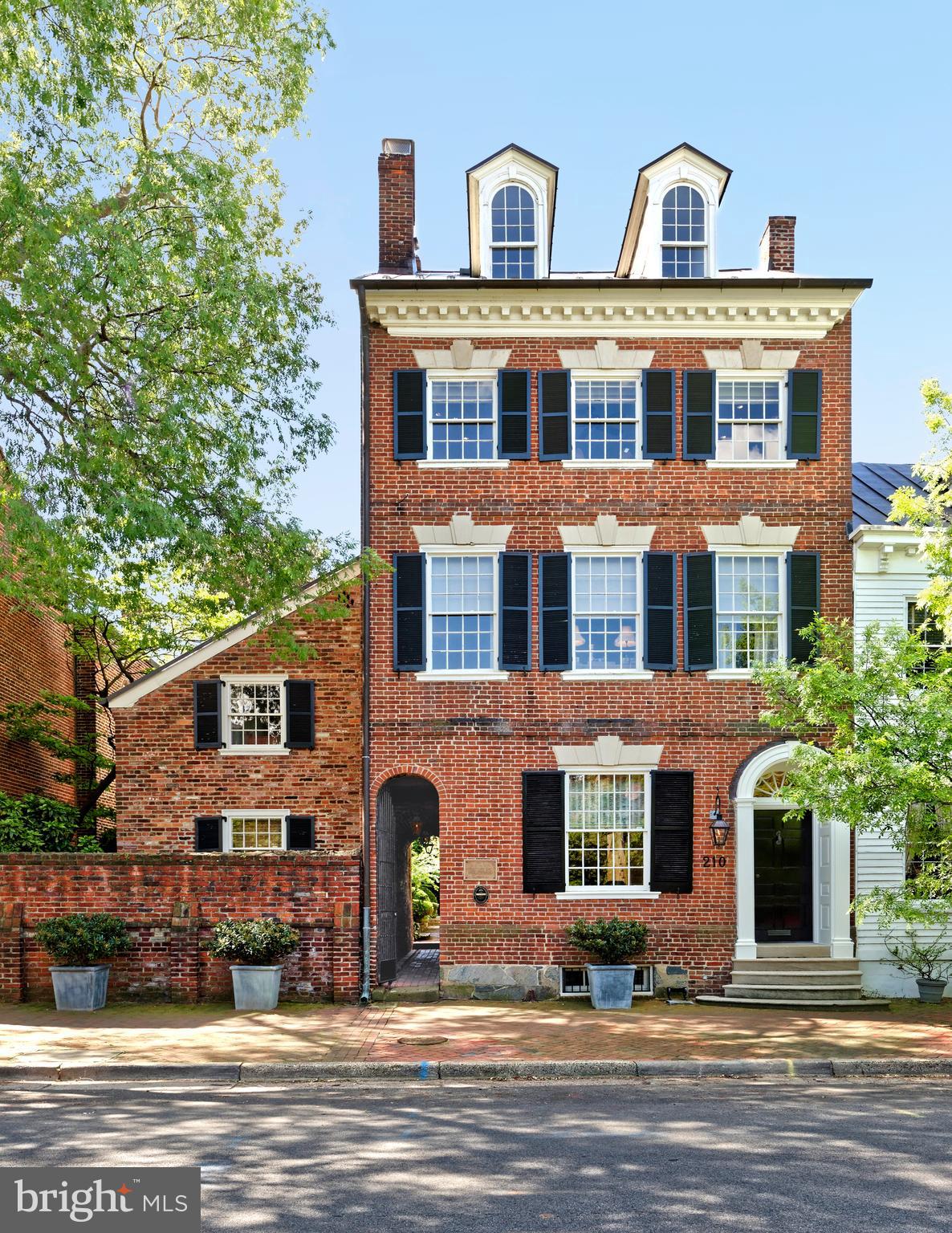 Built in 1787, this exquisite restored and renovated historic property is the former residence and medical office of George Washington's personal physician, Dr. James Craik.   Dr. Craik attended to President Washington in 1799 on his death bed at Mount Vernon, 8 miles south of Old Town.  His medical office was the first room of the house, just left of the front entrance.   Classic Georgian style architecture melds with elegant modern upgrades, expanded living space and carefully preserved original features. 
5 bedrooms, 3.5 baths, original heart pine floors, exquisite moldings, arched doorways, built-ins and 8 handsome fireplaces.  The Lobkovich kitchen adjoins a sunny family room overlooking the meticulously planted garden.  An attached flounder house with many windows and exposed beamed ceilings serves as an office or artist's studio.  The remarkable garden area can be viewed from numerous rooms.  A long grass panel softened with flower beds is surrounded by a reconstructed stonewall that once was the foundation of a former outbuilding on this property.  The gracefully-carved steps were said to be salvaged from the Blair House during a mid-20th century remodeling and brought to 210 Duke.   At the rear of the garden is a Zen-like swimming pool in a peaceful private setting for lounging and dining.  Off-street parking is accessed through remote-controlled grey wood double gates.   Minimum two hours notice for showings, please.   Showings through listing agent only.