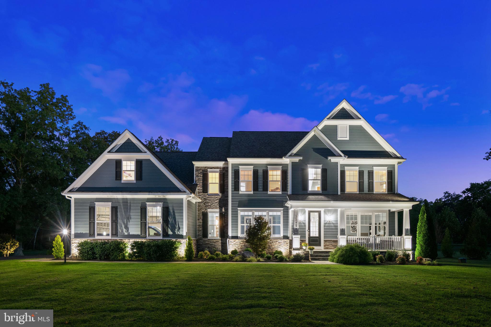 **THIS STUNNING HOME IS THE ONE YOU HAVE BEEN WAITING FOR**This 5 year young, 6984 sq ft, Stanley Martin Winslow Estate Home is available for the first time ever. The attention to COMFORT, ELEGANCE and DETAIL is obvious in every inch, both inside and out of this distinctive home reflecting the $500K+ in improvements.  No expense was spared in the creation of the RESORT STYLE 8+ ACRE backyard which boasts incredible privacy, including 2 PONDS, the largest with a beautifully lit FOUNTAIN and FIREPIT. This magnificent property backs to Fairfax County Parkland and walking trails with access to the Bull Run River and SYA Sports Park. The custom designed 5 STAR OUTDOOR AMENITIES includes a spectacular 2800 sq ft PORCELAIN TILE PATIO featuring a LUXURY PEBBLETEC SALTWATER POOL with tanning shelf, a 12 PERSON SPA with water fall, a 22’x22’ Covered PAVILION with 10’ FIREBLADE FIREPLACE and TV hookup, a Chef Level OUTDOOR KITCHEN with Lynx appliances including an Ice Maker, Refrigerator, Sink, Gas Grill with Side Burner and plenty of Storage. The exceptional Outdoor Kitchen also offers a comfortable bar area with seating for 6.  The oversized MOTORIZED AWNING provides plenty of shade for the Outside Kitchen on those hot summer days. The custom Landscaping and Walkways include decorative SELF WATERING PLANTERS and CUSTOM LIGHTING. Mobile Apps control everything from the pool, spa, Outdoor Lighting and a BOSE SOUND SYSTEM. With all this you will never want to leave your own backyard!  Inside, this home boasts 5 spacious bedrooms EACH with an en suite bath. The Laundry Room is conveniently located on the bedroom level. The PRIMARY SUITE is luxurious with hardwood floors, a huge light filled SITTING ROOM, bath with soaking tub, walk in glass surround shower and separate sinks.  The Primary Closet is enormous by itself but also has additional storage space over the garage area currently used as a YOGA STUDIO. On the main level the GOURMET KITCHEN with oversized Center Island features upgraded white cabinets, white quartz countertops and upgraded appliances all complimenting the CONTEMPORARY INTERIOR DECOR with custom chrome and glass light fixtures. The spacious and bright FAMILY ROOM features a 2 SIDED FIREPLACE which is shared with the oversized HOME OFFICE. The separate DINING ROOM is connected to the Butler Pantry with sink for ease in serving. There is also a light and bright SUNROOM off the Kitchen and a FORMAL LIVING ROOM on this level.  Last, but certainly not least, is the ONE OF A KIND designed BASEMENT which features the 5th Bedroom and Bath, a WET BAR with granite countertop and upgraded cabinets, an exclusive INDOOR GOLF STUDIO with Grass Mat flooring and Projection Screen. Next is a raised platform THEATRE SEATING area with designer wood working and accent wall. There are 2 Gaming Table areas for entertaining and finally the GYM and Pool House changing area with vinyl tile floors and BUILT IN STORAGE.  Energy efficient with Home Efficiency rating score of 52 (new home average of 100, resale home average 130).
GREAT commuter and shopping LOCATION with accessibility to South Riding, Dulles Landing, Fair Oaks/Fair Lakes and Gainesville. 30 MINUTES to Dulles Airport, 45 minutes to the Kennedy Center, 14 minutes to the Winery at Bull Run and 15 minutes to the Manassas National Battlefield Park. EASY COMMUNTING distance to Chantilly, Herndon, Reston, and Loudoun County. Don’t miss the opportunity to experience this one-of-a-kind property!