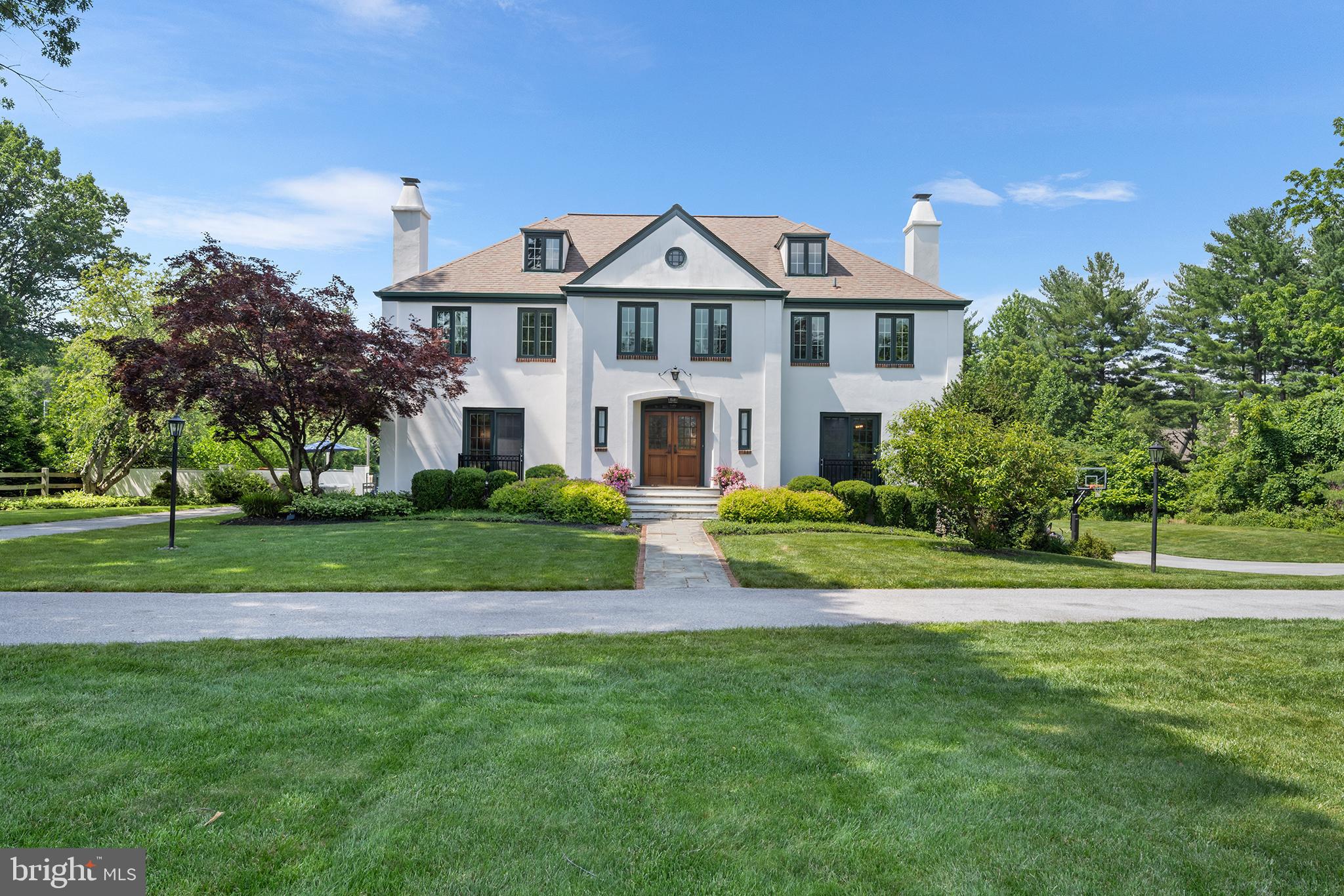 Welcome to 1263 Argyle Road, Berwyn, PA - A property like this is rarely offered!
Set at the end of a no through street in one of Berwyn’s most desirable neighborhoods, this gorgeous French Colonial is a rare find. With incredible curb appeal, an oversized driveway, and 2 pristine, manicured acres bordered by woods, this home offers privacy, beauty, and space to enjoy both inside and out. The neighborhood is perfect for walking, bike riding, and enjoying the peaceful surroundings—all within the award-winning Tredyffrin-Easttown School District.
The outdoor living space is an entertainer’s dream, featuring an in-ground pool, putting green, extensive hardscaping with multiple patios, a built-in fire pit, and plenty of yard left to relax, garden, or play.
Inside, the home boasts a bright, open floor plan with two large gathering rooms, a renovated chef’s kitchen outfitted with Viking and Sub-Zero appliances, a formal dining room, and a versatile first-floor office or in-law/au pair suite with full bath. Upstairs you'll find four bedrooms, three full baths and a laundry room equipped with cabinets for additional storage.  The spacious primary suite is adjoined by a large, light filled bathroom and custom oversized walk-in closet. 
A staircase leads from the second level to the unfinished third level offers over 500 sq ft of flexible potential—ideal for an additional bedroom, playroom, or home office. The walk-out lower level is designed for fun and function, with a sitting area and bar that open to a new flagstone patio with steps leading to the pool. Two more large rooms on this level provide additional space for recreation or relaxation.
Upgraded and meticulously maintained, this home has undergone many improvements throughout the current ownership. Enjoy a beautifully renovated kitchen featuring modern finishes, as well as significant hardscape additions that elevate the outdoor living space. Updates also include new electrical and lighting systems, upgraded HVAC, fresh interior paint, a new pool filter and heating system as well enhanced landscaping for added privacy and curb appeal.  Additionally,  the home also features a whole-house generator for uninterrupted power and peace of mind.
This is a rare opportunity to own a move-in-ready home that combines luxury, function, and lifestyle—all in one of the Main Line’s most sought-after locations!