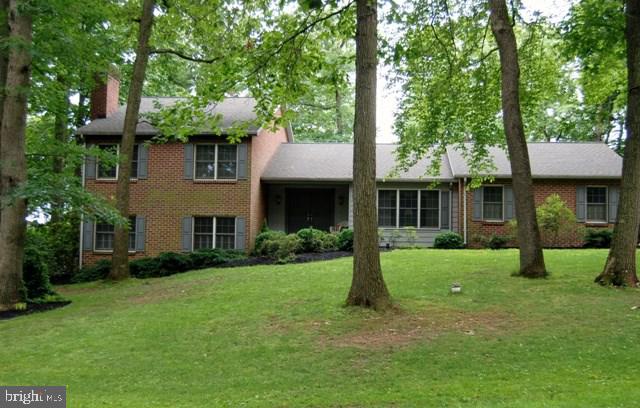 So much room in a well maintained home on .85 acre wooded lot. Gourmet kitchen, granite, tile, huge pantry, opens to 27x16 deck; Owners Suite, 4 piece bath has new tile; Lowest level FR with FP & wet bar, full bath; work from home in quiet den opening to stamped concrete patio. And the landscaped yard is a haven!  LL possible sep living. Newer roof, furnace, A/C