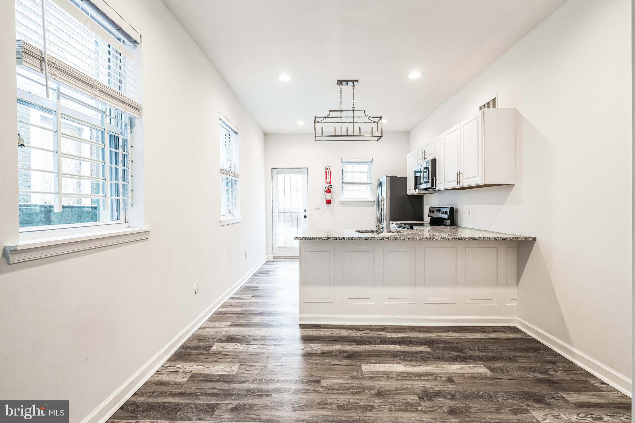 Renovated 4-Bedroom Townhome with Large Side Yard Included!

Welcome to 2205 N 19th Street, Philadelphia, a beautifully updated 4-bedroom, 2.5-bath townhome offering modern finishes, spacious living areas, and an expansive outdoor space! As part of this purchase, you also get the large side yard at 2207 N 19th Street, providing endless possibilities for gardening, entertaining, or future development.

Step inside to find an open-concept living area with stylish plank flooring, recessed lighting, and fresh neutral paint. The updated kitchen features sleek white cabinetry, granite countertops, stainless steel appliances, and a chic pendant light over the breakfast bar—perfect for casual dining.

Upstairs, enjoy four spacious bedrooms with plush carpeting and abundant natural light. The primary suite includes an en-suite bath, while the additional full and half baths offer convenience and modern updates.

Outside, the fenced-in backyard and extra side yard create a rare opportunity for outdoor living in the city. Whether you envision a private oasis, additional parking, or future expansion, this extra lot adds incredible value.

Conveniently located near public transit, local shops, and dining, this move-in-ready home is a fantastic opportunity. Don’t miss out—schedule your showing today!