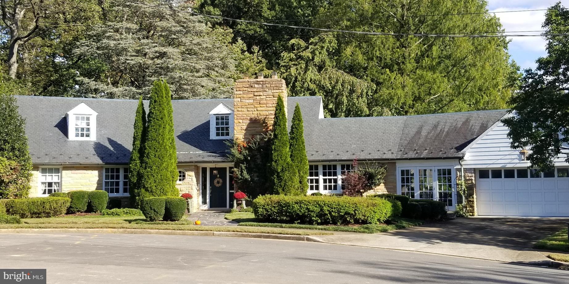Old world charm is evident throughout this custom built stone Cape Cod that is being offered for sale for the 2nd time in almost 70 years! Distinguished architecture is found in each and every room.  On the entry level you will find a large foyer, an expansive living room with an over-sized stone fireplace that has been converted to gas, a formal dining room, home office and bedroom with large sitting room (originally a bedroom) and 2 full baths. The kitchen can be what you want it to be so bring your kitchen designer and have at it.  The  covered porch overlooking the rear of the property adds to the beauty of this property.  The upper bedroom level consists  of 2 generous bedrooms plus a full bath.  On the lower level you will find a great room with a 2nd over-sized stone fireplace, sauna and fitness room, plus bonus rooms and an additional bedroom with a marble spa bath with heated floor and steam shower. The main floor garden room connects the 2 car garage to the main house.  And the best is yet to come! Venture outside and enjoy the 32,000 sq. ft. lot of privacy! No words can describe this personal oasis...green grass, open space, tiered slate patios with brick sitting walls and fireplace, all professionally landscaped in conjunction with the natural woods which surround the rear property.   MATCHLESS!