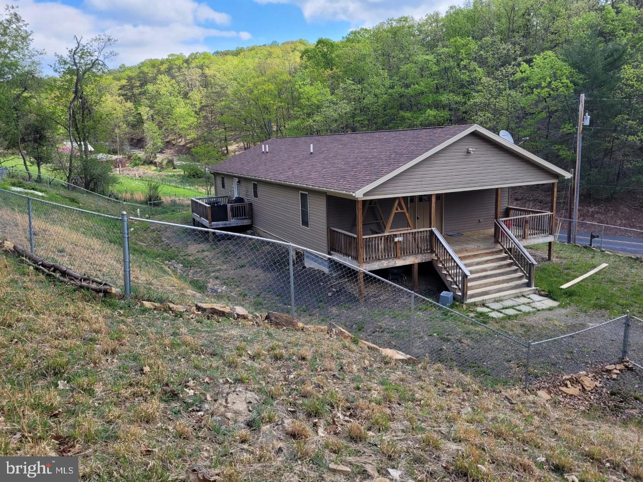 PRICE REDUCED, RECENTLY BUILT  HOME AT AN AFFORDABLE PRICE!!!!! NO H.O.A, NO RESTRCITIONS, FRONTING ON A STATE MAINTAINED ROAD, THIS 1800 SQ FOOT HOME WAS BUILT IN 2018, OPEN FLOOR PLAN WITH PLENTY OF ROOM FOR THE GROWING FAMILY! THIS SPACIOUS RANCHER SPORTS 4 BEDROOMS, 2 FULL BATH'S, RECESS LIGHTING, CITY WATER, CITY SEWER, FRONT AND REAR DECKS, CENTRAL HEAT/AC, CHAIN LINK FENCING. ONE OF THE BEST FEATURES IS THE LOCATION, IT IS A NICE COUNTRY SETTING, BUT IN A PRIME LOCATION, JUST MINUTES FROM SCHOOLS, DOCTOR'S OFFICE, SHOPPING, AND TOWN. TAKE A STEP BACK AND LISTEN TO THE WILDLIFE, THIS COULD BE THE PLACE YOU CALL HOME FOR MANY YEARS TO COME.