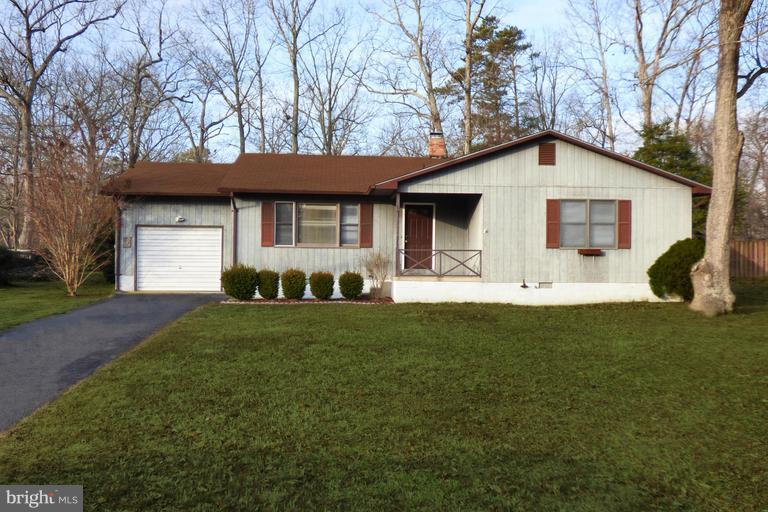 Welcome home!  Located at the end of a cul-de-sac, perfect for walking your dog.  This large open floor plan is sure to please.  Massive family room off kitchen has a REAL wood burning fireplace!   Bedrooms are much larger than average.  New carpet, washer, dryer and fresh paint.
