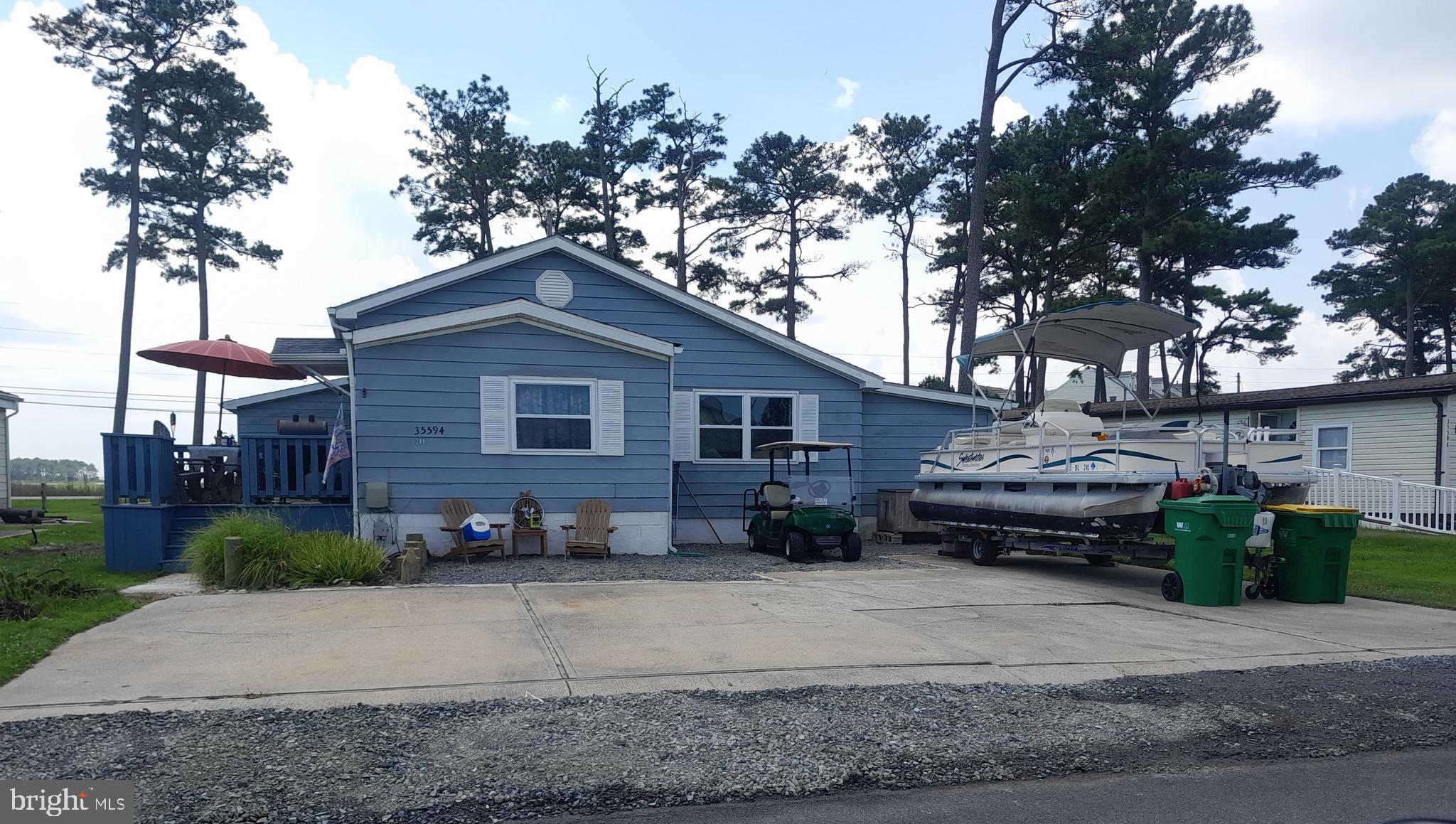 Coastal charm meets convenient beach-area living at 35594 Sussex Lane in Mariners Cove! 

As you arrive, you’ll immediately notice the oversized newly stoned driveway — perfect for parking your boat, golf cart, and additional vehicles with ease. Step into this beautifully updated 1,900+ sq. ft. home featuring 3 bedrooms and 2 bathrooms, plus flexible bonus spaces like a possible additional bedroom, den, office space, and even your own hot tub hookup!

This move-in ready home is packed with updates including a freshly painted interior, updated bathrooms with new vanities, showers, and comfort-height toilets with soft-close lids, along with brand-new kitchen appliances (refrigerator, microwave, and stove) from 2024. The cozy new fireplace creates the perfect space to relax and unwind.

One of the standout features of this home is the massive sunroom with soaring vaulted ceilings and an abundance of natural light, leading directly out to the back patio with a spacious fenced-in backyard — ideal for entertaining, relaxing, or pets. You may also enjoy your morning coffee on the front deck. 

Additional perks include trash and sewer already paid for the year, plus the remaining fuel in the tanks conveyed at settlement, making your move even easier. Conveniently located just minutes from boating, beaches, shopping, and local favorites like Paradise Grill and Paradise Pub, this property is perfect as a primary residence, vacation getaway, or investment opportunity!
Starting Aug 1st Lot Rent will be $879.71. Sellers are willing to pay 2 months of lot rent with an acceptable offer.