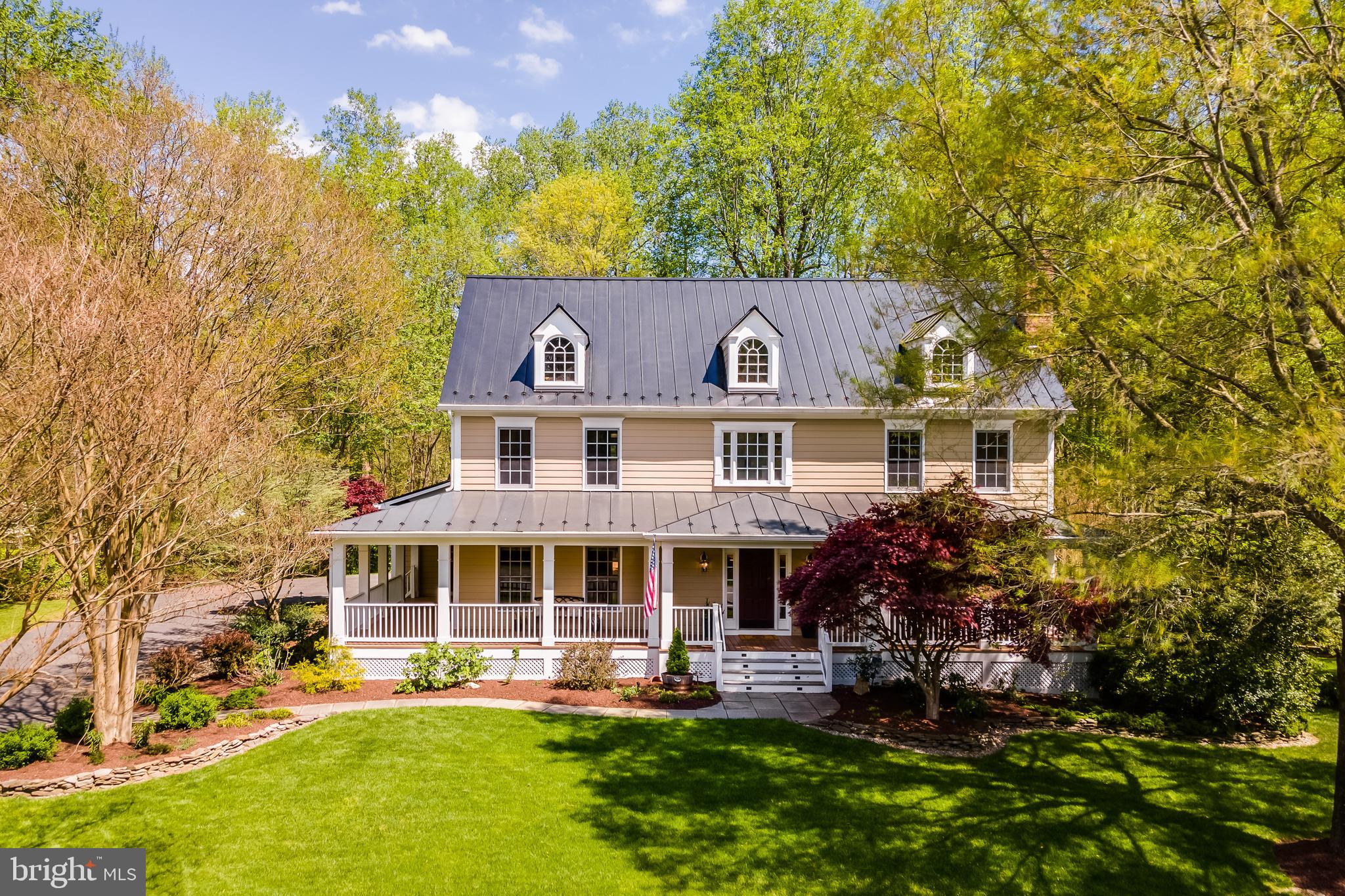 There's so much special about THIS HOUSE--where to start?!?  This Southern Living Designed home IS VERY spacious, beautifully updated, and well-appointed, has 5 large bedrooms, 4.5 baths and sits on 5 acres in a superior location YOU will love!  Significant updates inside and out have been added, including a stunning kitchen renovation with custom cabinets, backsplash, upscale stainless steel appliances, counters, lighting, and more. The main level features a large and welcoming foyer, charming living room with gas fireplace,  the lovely updated kitchen, very large dining room, expansive great room with gas fireplace, main-level office, powder room, and laundry. The primary suite features a spectacular bathroom renovation with large shower, separate soaking tub, heated floors, separate water closet, and two separate vanity areas.  There will be no fighting over bathrooms in this house as the bathroom situation upstairs is A+++.  The two front bedrooms share a delightful Jack and Jill bathroom with each bedroom having its own separate vanity area.  The fourth upper bedroom has its own private bathroom.  So nice!!!!  The lower level of this home is also just wonderfully appointed with a large family room/multipurpose area, another bedroom, an additional full bathroom, and tons of storage.  This home has fantastic outdoor areas.  There is a large Ipe deck off the kitchen and it's just beautiful.  Outside of the walkout basement doors you'll find a large stone patio,  perfect for a firepit and s'mores over the summer.  There's landscape lighting, well-groomed beds with delightful plantings, grassy play areas, woods for privacy and adventures, and an in ground sprinkler system! The roof of this house is a real boon--all metal and low maintenance!  Renovations: kitchen and appliances 2023 to include a lovely Liebherr fridge;  Miele washer and dryer, 2021; metal roof 2021; siding painted 2021; upper heat pump 2022; main furnace 2024; 75 gallon water heater 2022; primary bathroom 2023; Jack and Jill bathroom 2022; home has in-ground sprinkler system.  This home has it ALL!  And the location of this home really makes it a stand out!  Located just a short distance from Rt 123, but feeling like many miles away, you'll enjoy endless tranquility on this 5 acre lot while being just right down the road from shopping, restaurants, schools, and the VRE!