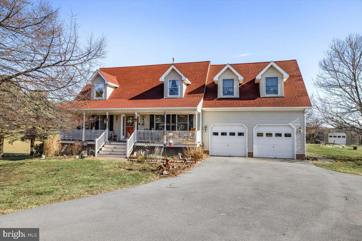 Nestled in the peaceful countryside, this classic Cape Cod home sits on 5 scenic acres, offering breathtaking views and plenty of space to enjoy country living. With five bedrooms, three and a half baths, and a fully finished basement with a second kitchen, this home is perfect for  multi-generational living or hosting guests.
The first floor features crown molding, creating an elegant touch throughout the spacious living areas. A brand new roof, new appliances and new storm doors ensure modern convenience and peace of mind. The fenced in yard provides a safe and secure space for pets or children to play. Outside, a detached garage and barn offer plenty of storage or workspace, making this property ideal for hobby farming, horses, or additional projects. Whether you are enjoying the privacy of your acreage, relaxing on the porch or deck, or entertaining in the finished basement, this home combines classic charm with modern updates. Also, there are many fruit trees to enjoy! Huckleberries, Mulberries, raspberries, blackberries and apricots too! Don't miss the opportunity to own this beautiful country retreat-schedule your private showing today!