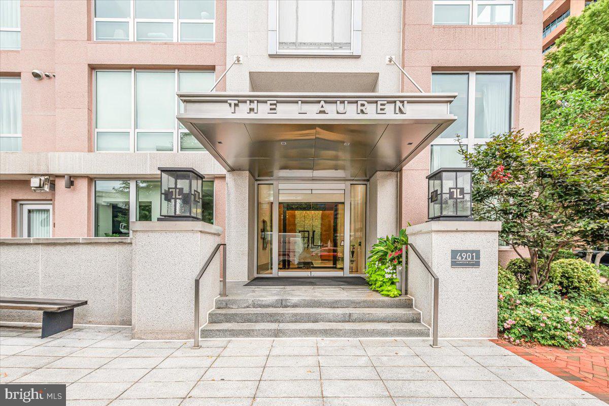 Welcome to a residence of unparalleled refinement at The Lauren, one of Downtown Bethesda's most prestigious addresses. This impeccably designed two-bedroom, two-bathroom unit offers a masterclass in luxury living, from the radiant heated floors in the spa-inspired baths and kitchen to the custom-paneled built-ins framing the living room fireplace. The owner’s suite serves as a peaceful sanctuary, perfectly positioned among expansive windows to offer a serene escape. Every bedroom and closet is outfitted with built-in systems, making this condo a truly turn-key home. Residents enjoy world-class amenities, including 24/7 white-glove concierge service and a dedicated on-site management team committed to catering to your every need. While the home’s comfort may tempt you to stay inside, the vibrant dining and shopping of Downtown Bethesda await just steps from your front door.