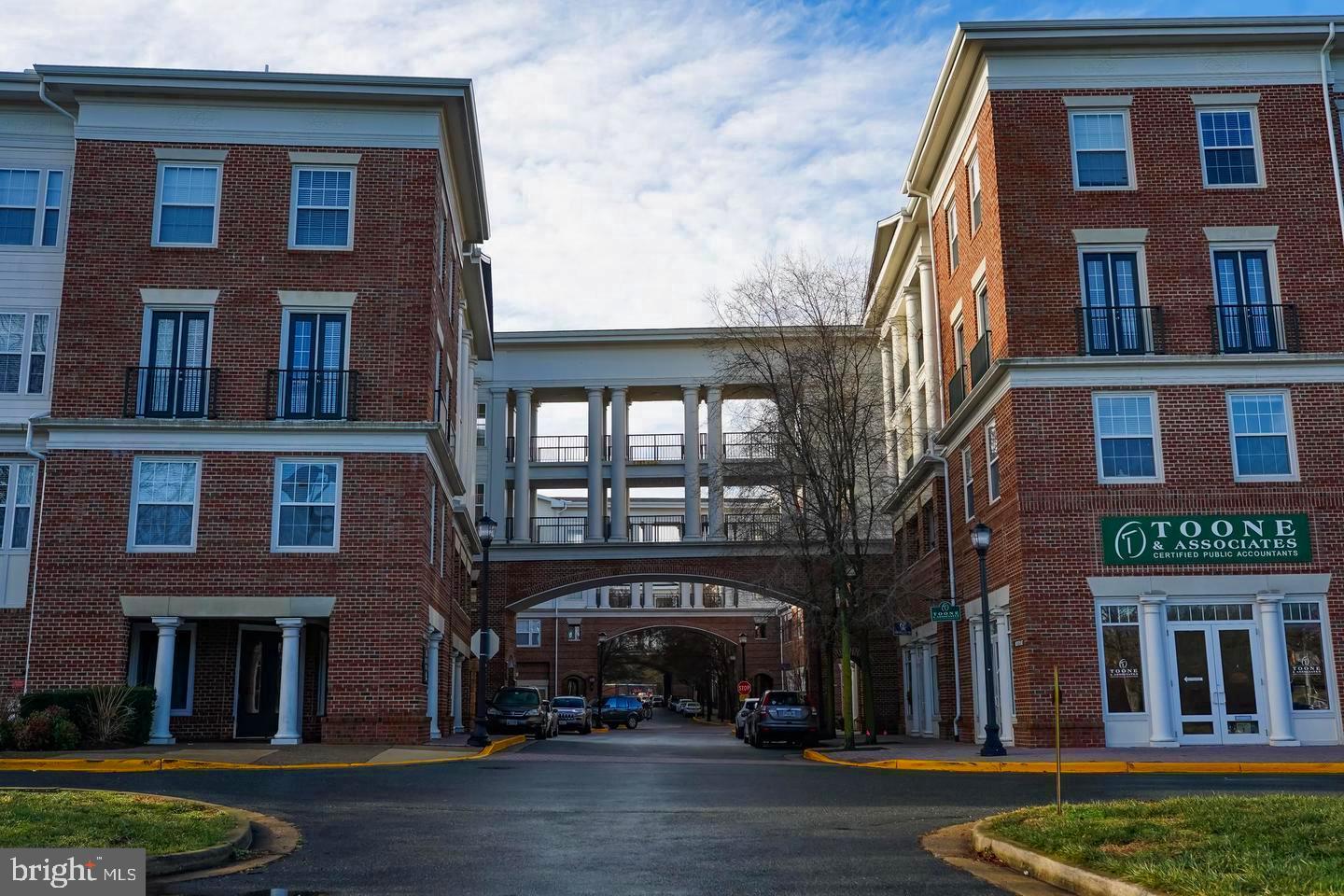 Beautiful two bed two bath at the Colonnade Condominiums! Hardwood floors, spacious bedrooms, and gas fireplace. Conveniently located walking distance from all retail, restaurants, and grocery in the Kentlands. Amenities include pool, library, lounge, and fitness center!