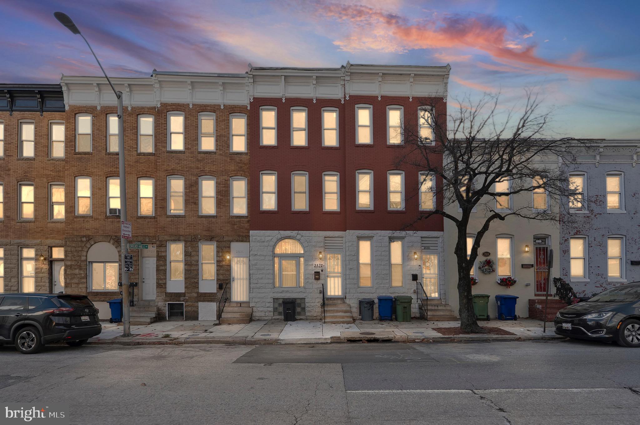 Step into a beautiful blend of historic charm and modern convenience at 2532 Druid Hill Ave, a striking Baltimore rowhome that makes a grand first impression with its classic brick facade and soaring ceilings. This residence has been thoughtfully updated to offer a turnkey experience, featuring an open-concept main level where sun-drenched living spaces flow seamlessly into a gourmet kitchen outfitted with sleek stainless steel appliances and stone countertops. The upper level serves as a true retreat, highlighted by a primary suite with a spa-inspired bathroom and additional generous bedrooms that offer plenty of flexibility for a home office or creative studio. Perfectly positioned in a vibrant corridor, this home puts you moments away from the lush greenery and recreational trails of Druid Hill Park, as well as the Maryland Zoo and the Conservatory, offering a lifestyle of connectivity and ease in the heart of the city.