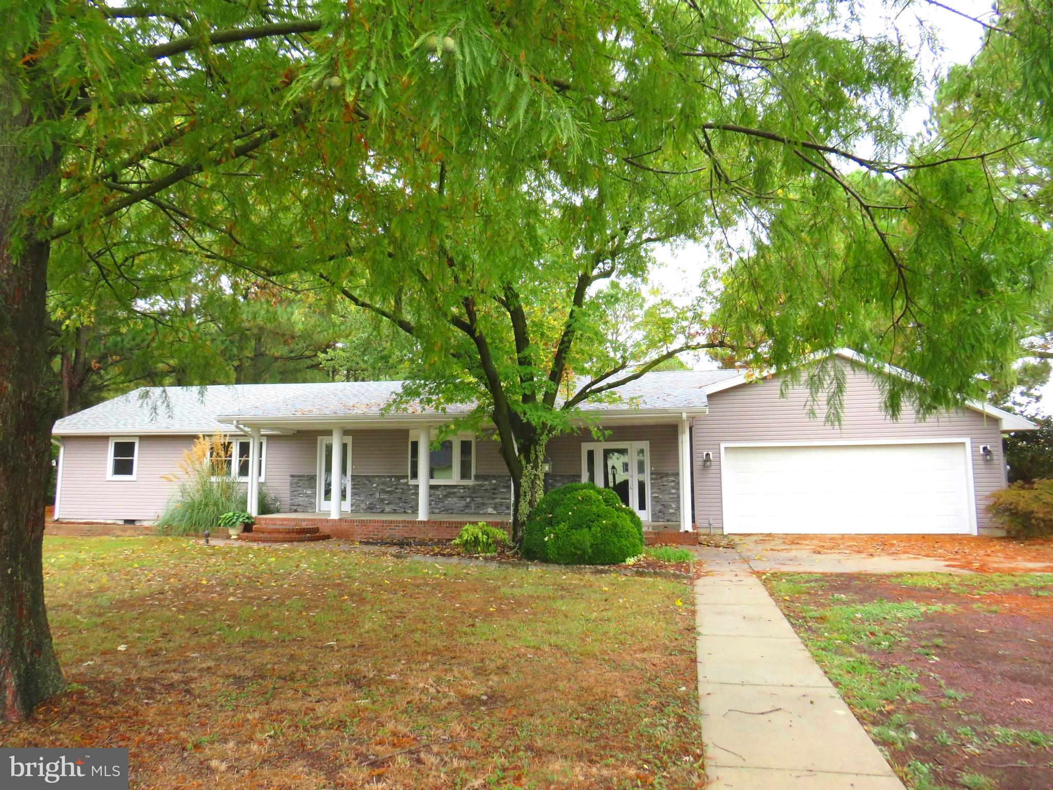 This house gives mid century modern feels with the open front porch, stacked stone trim and low profile design.  Inside the home has been completely renovated to suit modern aesthetic.  LVP flooring, gorgeous kitchen with granite countertops, stainless appliances, soft close cabinetry, and a center island.  Open floor plan flows into the living room with a fireplace.  This home is perfect for entertaining! Four bedrooms, three baths, primary bedroom has access to deck at rear of home, primary bath has custom tiled shower with rain showerhead feature, and a double vanity.  Additional two full bathrooms have tiled flooring and tub/shower combination.  Dock space for two boats, deep water canal with easy access to Jones Creek and the Annemessex River for boating and great fishing.  Attached two car garage. with paved driveway.   Additional photos to be posted soon!