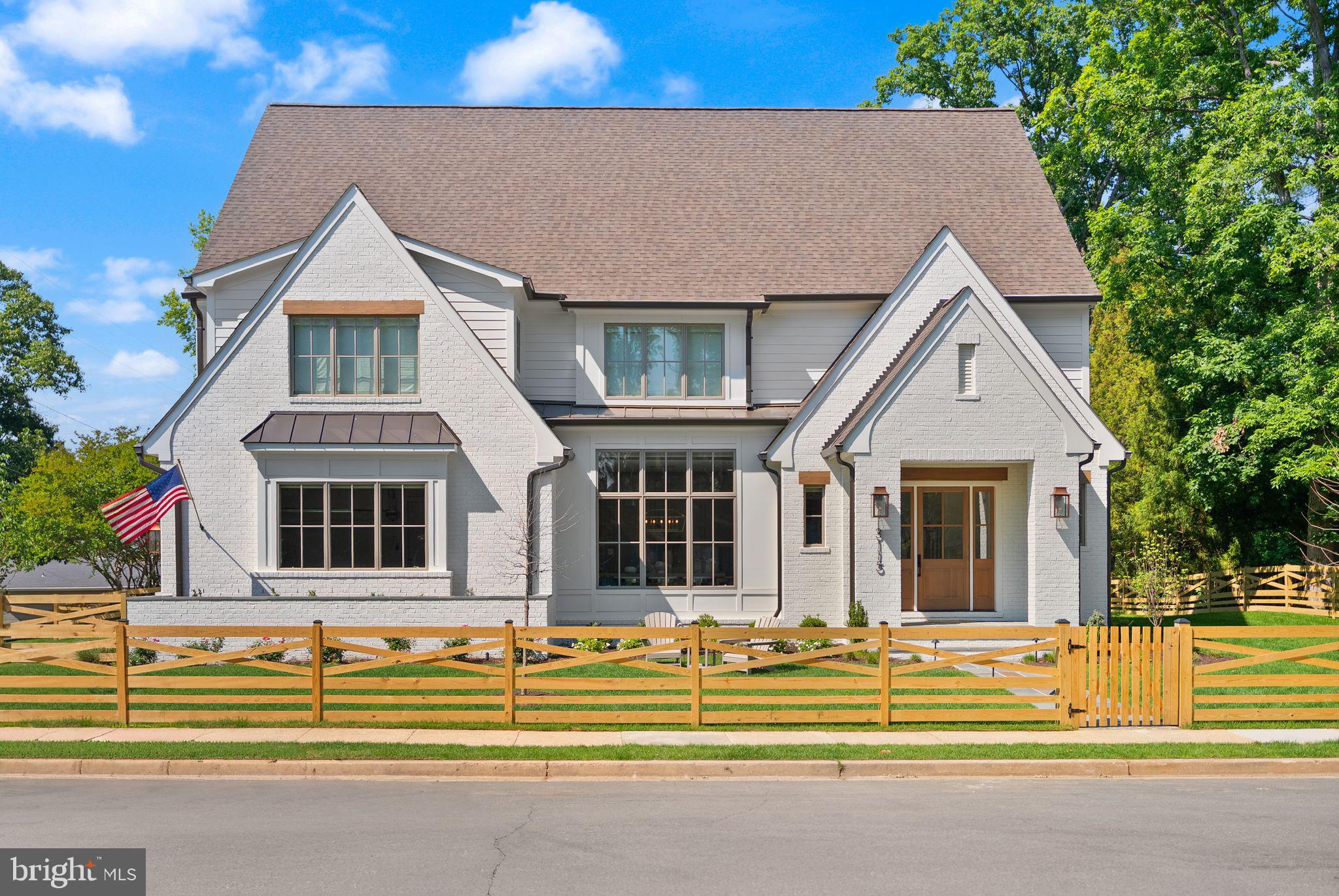 Introducing 3115 N Peary St, a recently delivered custom home, offering the feel of new construction without the wait. Thoughtfully designed by MR Custom Homes, this property is in the heart of Bellevue Forest, offering just under 7,700 square feet across four finished levels with a layout that balances everyday functionality with refined living. From the moment you enter, the home unfolds with intention. 10’ ceilings, wide-plank white oak flooring, and a seamless flow between formal and casual spaces. The kitchen serves as the anchor of the main level, equipped for both daily living and elevated hosting with a full suite of professional-grade appliances, custom inset cabinetry, an oversized island, and a walk-in pantry. It opens naturally to the family room, where a coffered ceiling and wood-burning fireplace create a warm, architectural focal point, and extends outward to a screened porch designed for three-season enjoyment. The main level also offers a private guest suite (or office or playroom) with en-suite bath, a formal dining room with butler’s pantry, a separate living room or library with French doors, and a well-appointed mudroom off the two-car garage. Upstairs, the primary suite is designed as a true retreat, featuring dual walk-in closets and a spa-inspired bath with heated floors, soaking tub, and oversized glass-enclosed shower. Three additional bedrooms, each with en-suite baths, and a dedicated laundry room complete this level. A top-floor loft with full bath provides flexible space for guests, work, or an au pair suite. The lower level is equally well-appointed, offering a large recreation space with wet bar, an additional bedroom and full bath, a fitness room, and ample storage. Additional features include built-in audio, elevator rough-in, and a screened porch with skylights, heaters, and direct access to the backyard and patio, creating an effortless indoor-outdoor connection. Ideally located just moments from nature trails, parks, and the Washington Golf & Tennis Club, with easy access to Washington, DC and top-rated Arlington schools, this home offers a rare combination of scale, design, and location within one of North Arlington’s most established neighborhoods.
