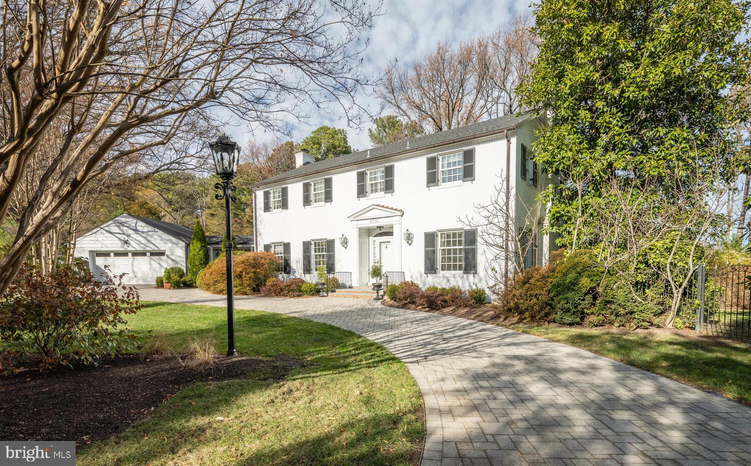 This amazing property is truly one of a kind and one you must see to believe. Sited on a very private lot of over 1.25 acres, the home features five bedrooms, three full baths, pool and pool house and a two car garage. The home is grand, with 9 foot ceilings on the main level. Enter into the foyer and walk into a very large, formal living room with fireplace. This space opens up to a sitting room and flows easily to the dining room, which can easily accommodate 12+. Beyond the dining room is a convenient butler's pantry with access to the kitchen - both were recently renovated and feature inset cabinetry, marble counters and backsplashes. The kitchen boasts a Thermidor refrigerator and Viking cooktop with separate double wall ovens. An adjoining pantry/mudroom has additional cabinetry, laundry,  built-in shelving, an additional refrigerator and plenty of counter space. In the rear of the home, you will find an extraordinary family room - with beautiful vaulted ceilings, hidden storage, an oversized fireplace and more; this is the perfect room to host parties or enjoy cozy nights by the fire. Just off the family room is a wood-paneled sunroom. This light and airy room is great for more casual get-togethers or overflow space while entertaining. Off the family room is a grand screened porch, with plenty of space for relaxing or hosting! Rounding out this level is an office/library with an adjacent full bathroom. Head upstairs to five bedrooms and two full bathrooms. The primary features three closets and an en-suite bath. The renovated bathroom features an oversized shower, double vanities and a linen closet (the bath also has access to the walk-up attic). The second bedroom (currently an office) has a great size, vaulted ceiling and beautiful light. Two additional large bedrooms and one smaller bedroom with a hall bath round out this level. The grounds of this property are simply stunning. A two car garage is adjacent to the main house- accessible under a breezeway. Beyond that is the pool (20' by 40')and pool buildings - one 6' by 10' for equipment and one 12' by 10' - great for a shady nap or watching TV in between swims. The pool liner was replaced in 2022, and the pool has a solar cover on a roller that easily gets the pool up to 90 degrees by early summer. Mature plantings and trees dot the landscape. To the right of the main house is additional side yard space with a 10' by 16' garden shed. Park in the garage or pull up to the front using the circular driveway - you do not want to miss this spectacular home.
