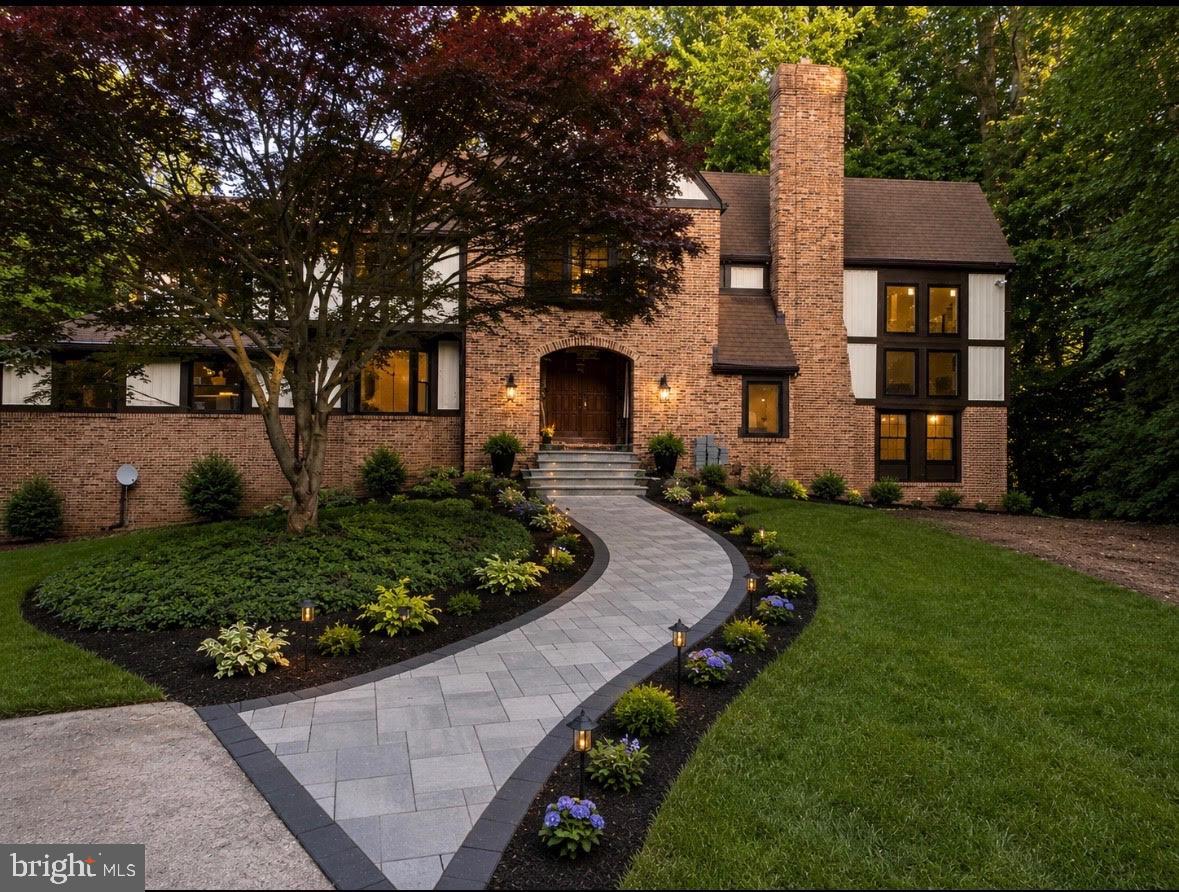 Where timeless elegance meets modern luxury, this extraordinary Howard County Tudor is the home dreams are made of. Meticulously renovated from top to bottom with impeccable attention to detail, this exceptional residence offers refined living, grand entertaining spaces, and resort-style outdoor amenities.

A breathtaking two-story foyer welcomes you with rich exposed brick accents, soaring ceilings, and dual coat closets, setting the stage for the sophistication found throughout. The dramatic great room is the centerpiece of the home, showcasing 18-foot ceilings, expansive windows that flood the space with natural light, and a stunning wood-burning fireplace that creates an atmosphere of warmth and grandeur.

Designed for both elegant entertaining and everyday living, the formal dining room provides the perfect setting for memorable gatherings, while the distinguished library, complete with custom built-in cabinetry, offers an ideal executive home office or private reading retreat.

The spectacular gourmet kitchen is a chef's masterpiece, featuring premium finishes, abundant cabinetry, and an open-concept design that flows effortlessly into the inviting family room, where a second wood-burning fireplace creates the perfect backdrop for intimate evenings with family and friends.

The upper level is a luxurious sanctuary, featuring brand-new plush carpeting throughout and four generously proportioned bedrooms. The lavish primary suite serves as a private retreat, complete with a spa-inspired bath boasting an oversized walk-in shower, dual vanities, designer finishes, and a spacious walk-in closet designed to accommodate every wardrobe.

The fully finished lower level elevates the home's entertainment offerings with luxury vinyl plank flooring, a stylish wet bar complete with a wine refrigerator, a temperature-controlled wine cellar, a potential fifth bedroom, generous storage, and an included pool table—creating the ultimate destination for game nights, celebrations, and unforgettable gatherings.

Step outside to your own private oasis. An expansive deck overlooks a beautifully landscaped backyard framed by mature trees, offering exceptional privacy. The stunning in-ground pool and spa transform the outdoor space into a five-star retreat, perfect for relaxing summer afternoons, elegant al fresco dining, or entertaining on a grand scale.

Perfectly blending classic Tudor architecture with sophisticated contemporary finishes, this remarkable residence offers an unparalleled lifestyle in one of Howard County's most coveted communities. Every space has been thoughtfully curated to deliver comfort, elegance, and luxury at every turn.